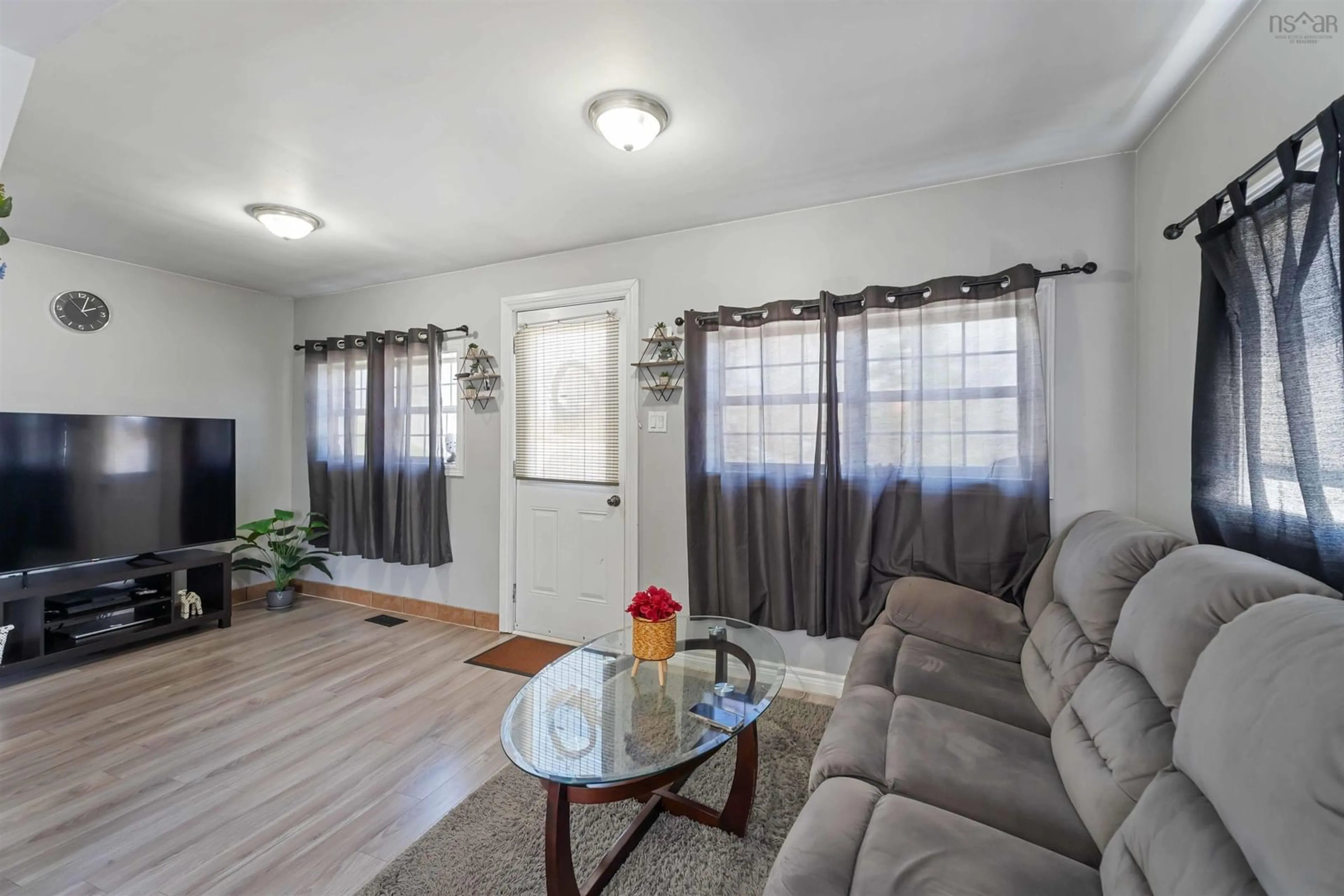 Living room with furniture, wood/laminate floor for 886 King St, Windsor Nova Scotia B0N 2T0