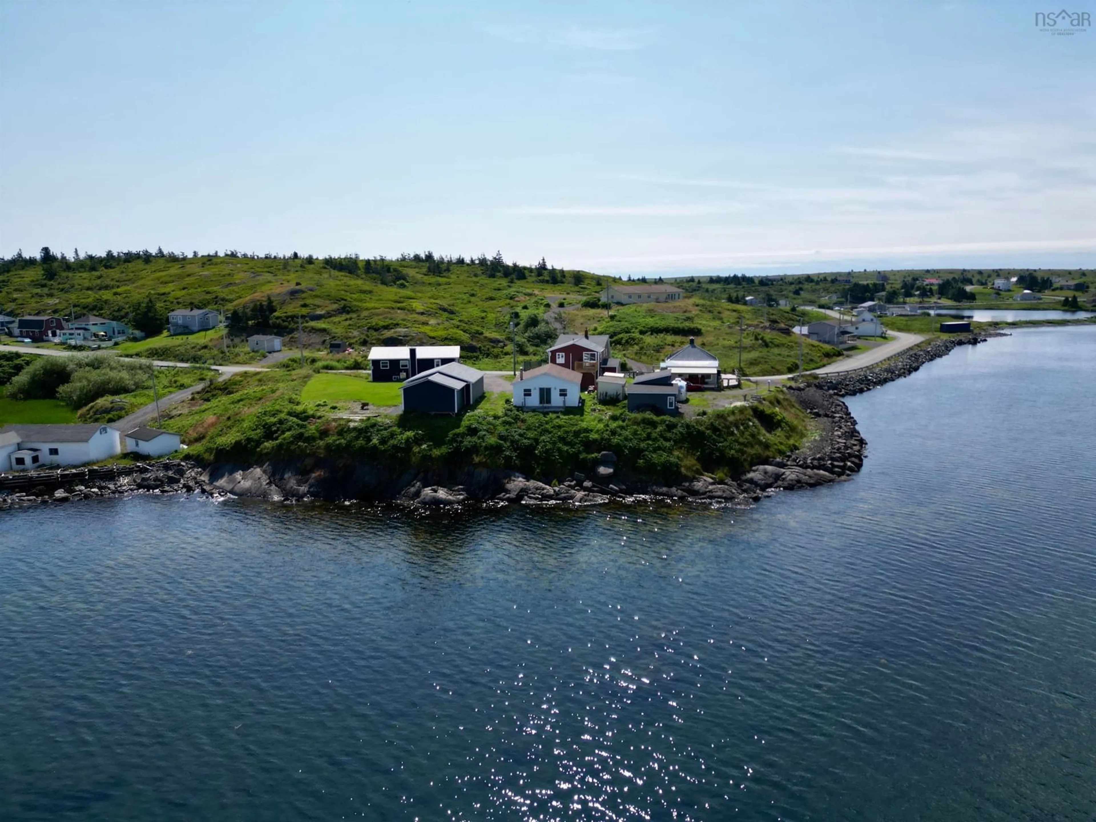 A pic from outside/outdoor area/front of a property/back of a property/a pic from drone, water/lake/river/ocean view for 276 Southside Petit De Grat Rd., Alderney Point Nova Scotia B0E 2L0