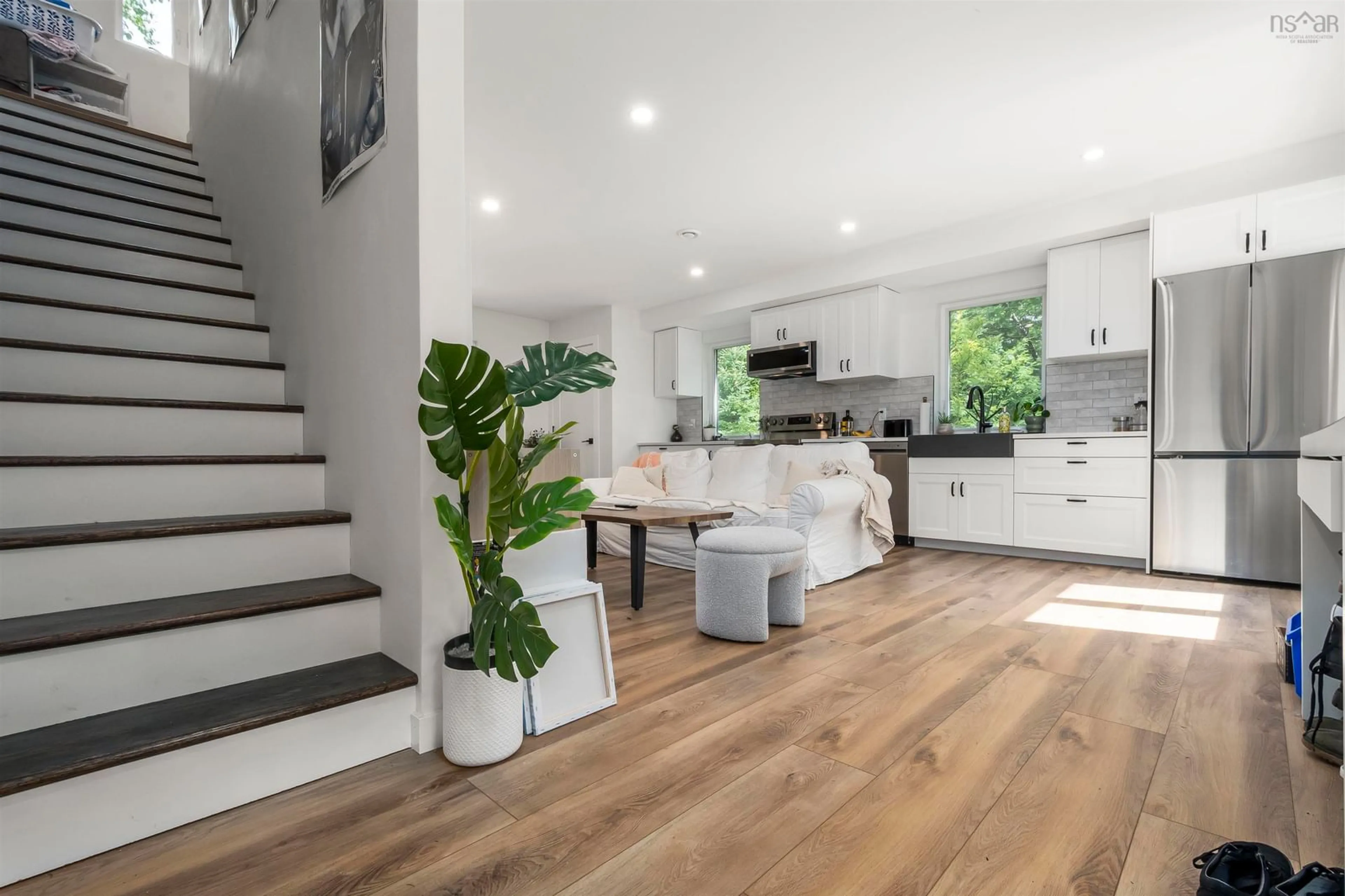 Open concept kitchen, wood/laminate floor for 20 1/2 Melville Ave, Halifax Nova Scotia B3P 1E1