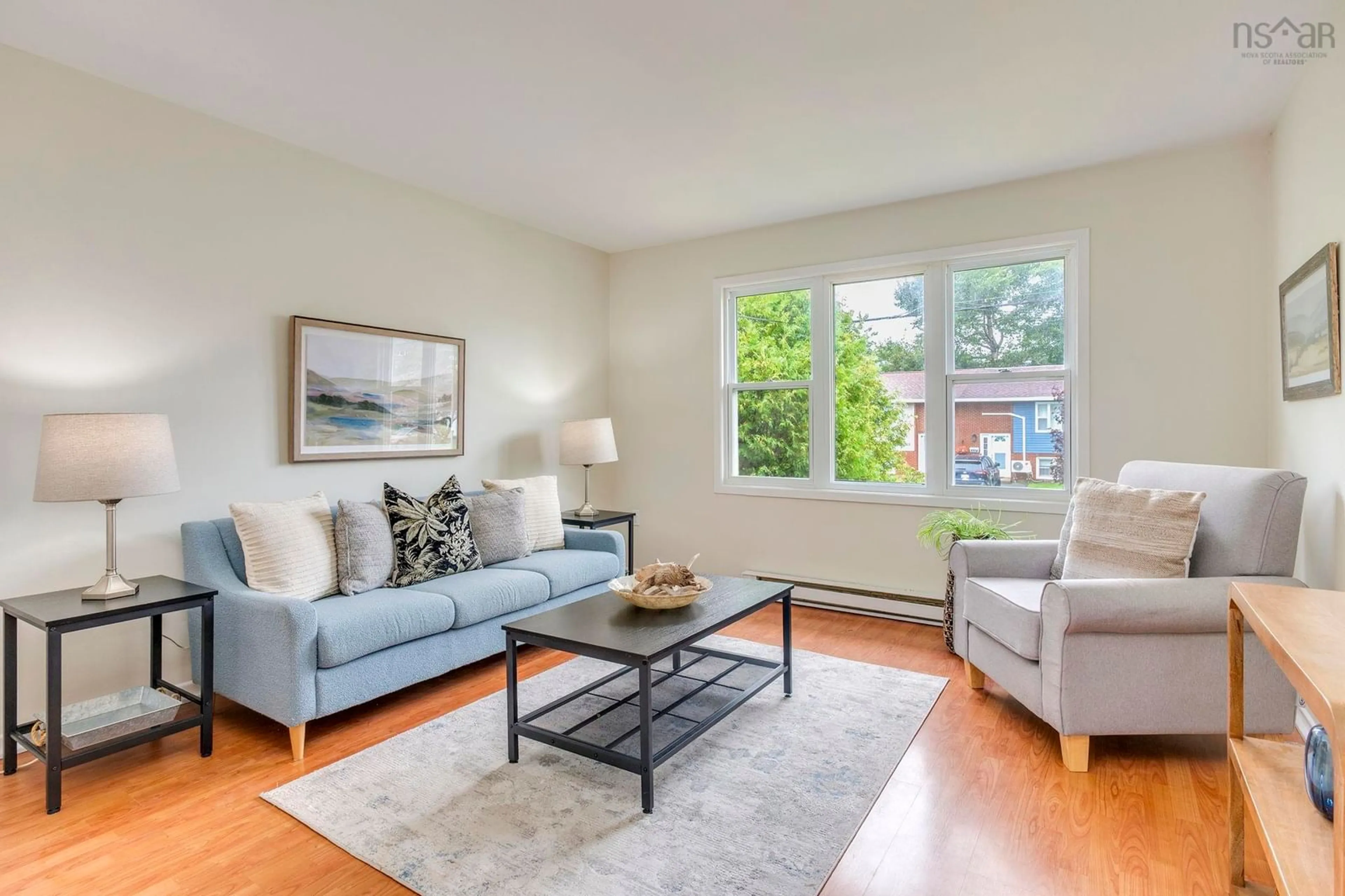 Living room with furniture, wood/laminate floor for 448 Renfrew St, Dartmouth Nova Scotia B2Y 2M5