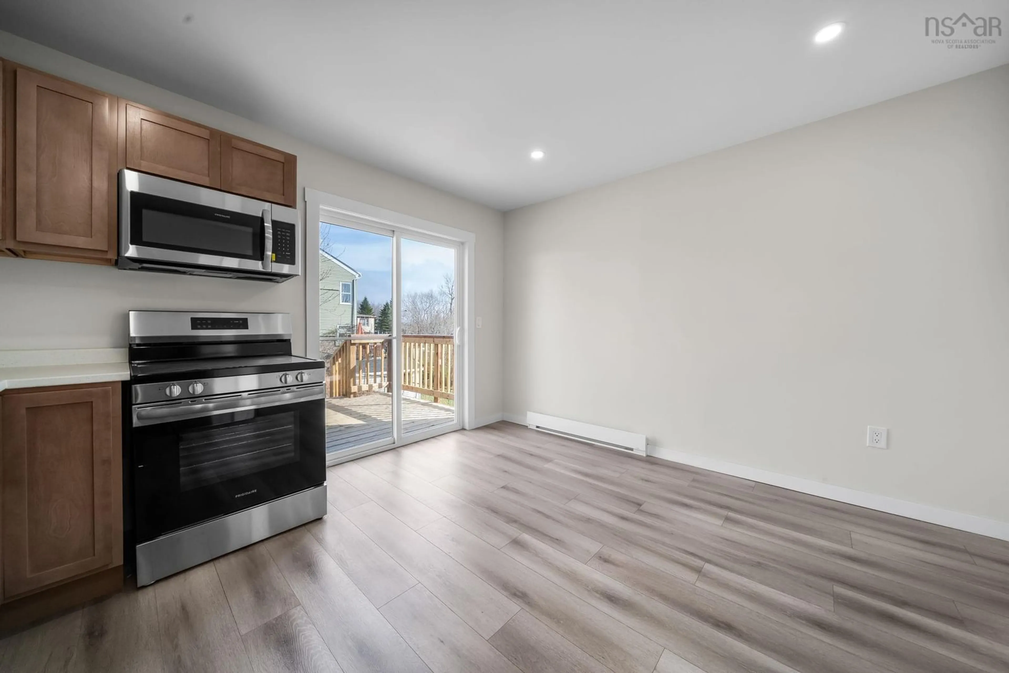 Open concept kitchen, wood/laminate floor for 56 Irving St, Dartmouth Nova Scotia B2W 1K2