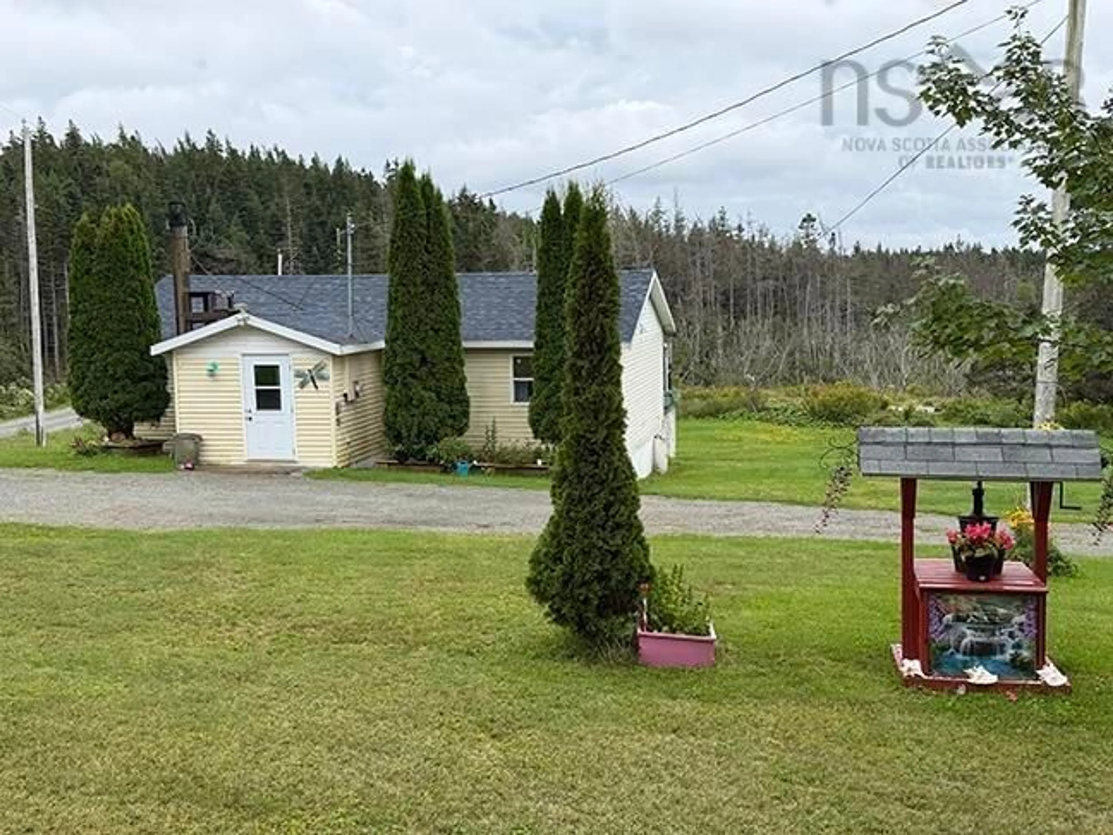A pic from outside/outdoor area/front of a property/back of a property/a pic from drone, unknown for 66 Richards Pond Rd, River Bourgeois Nova Scotia B0E 2X0