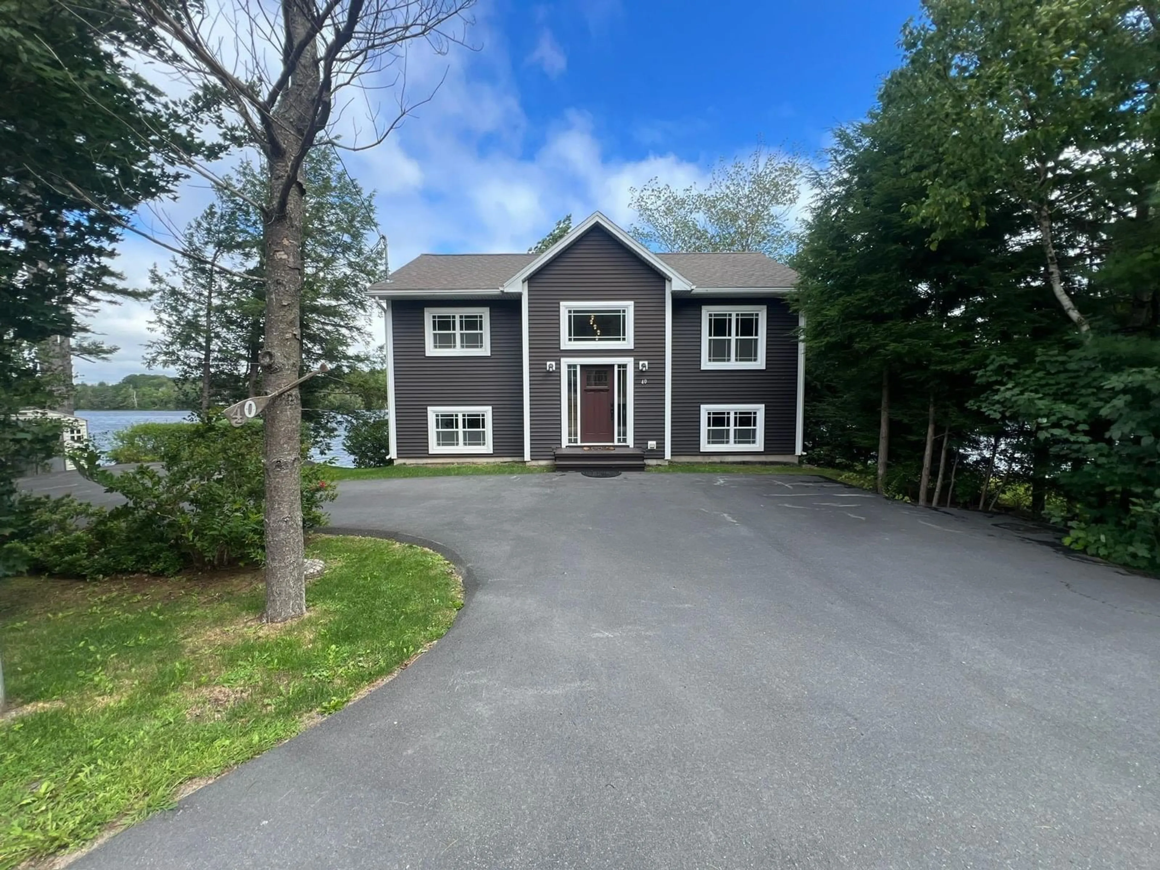 A pic from outside/outdoor area/front of a property/back of a property/a pic from drone, water/lake/river/ocean view for 40 Tucker Lake Rd, Beaver Bank Nova Scotia B4G 1C3