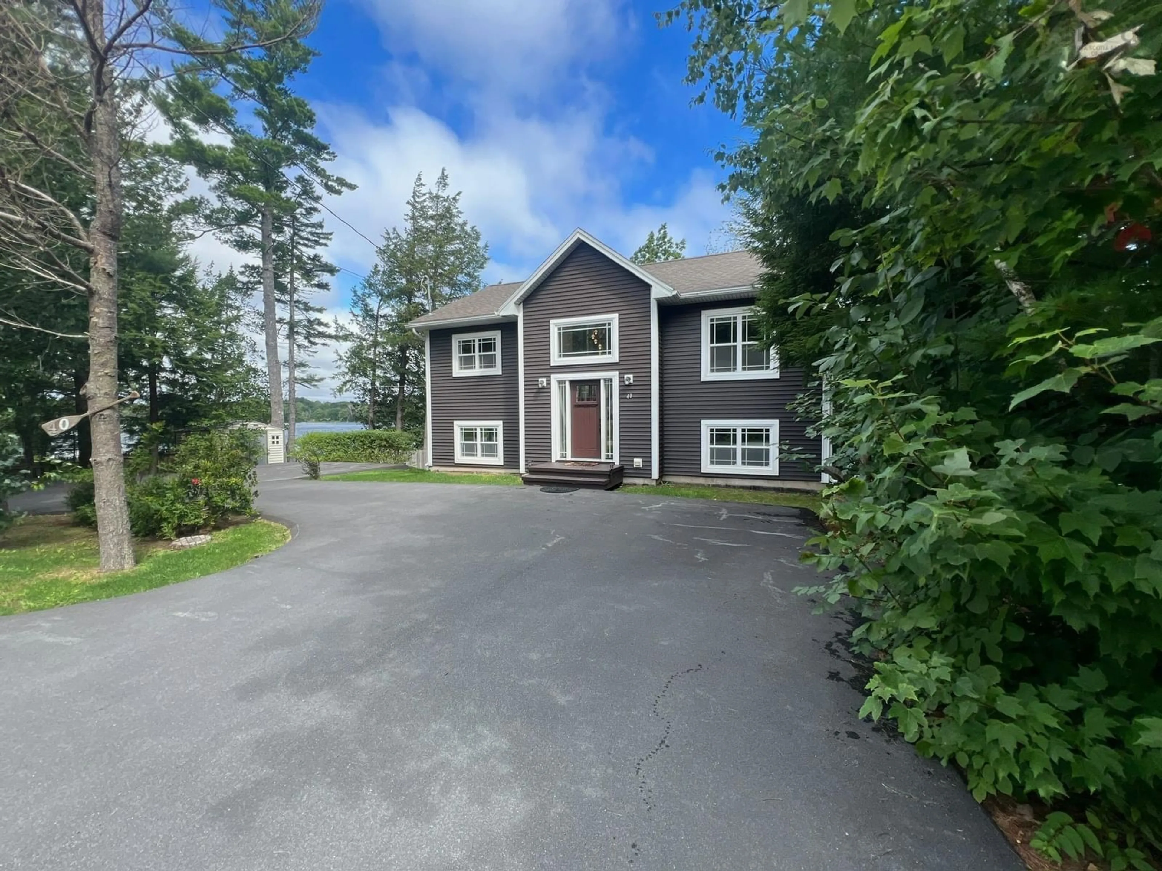 A pic from outside/outdoor area/front of a property/back of a property/a pic from drone, unknown for 40 Tucker Lake Rd, Beaver Bank Nova Scotia B4G 1C3