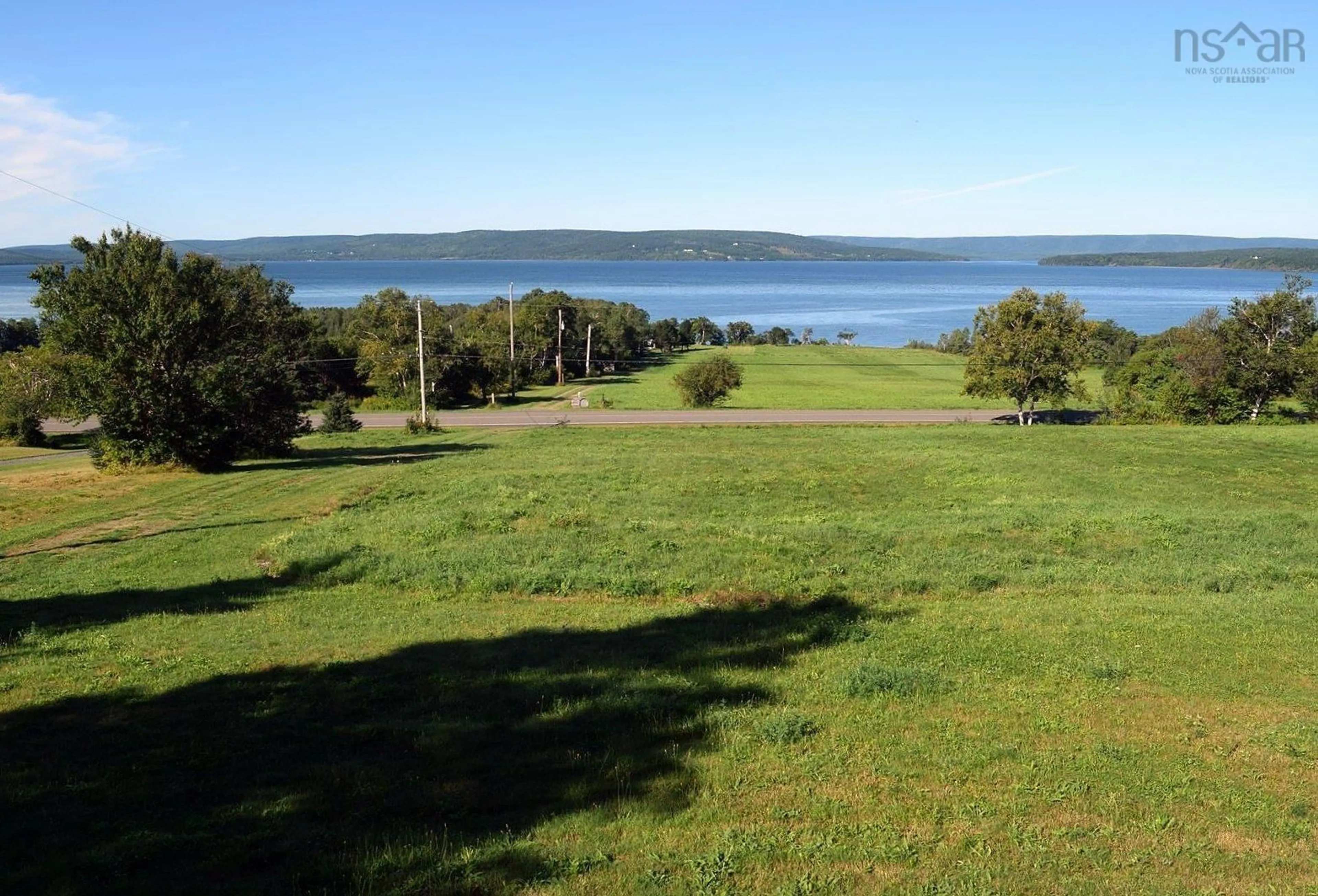 A pic from outside/outdoor area/front of a property/back of a property/a pic from drone, water/lake/river/ocean view for 3898 Hwy# 95, East Lake Ainslie Nova Scotia B0E 3M0