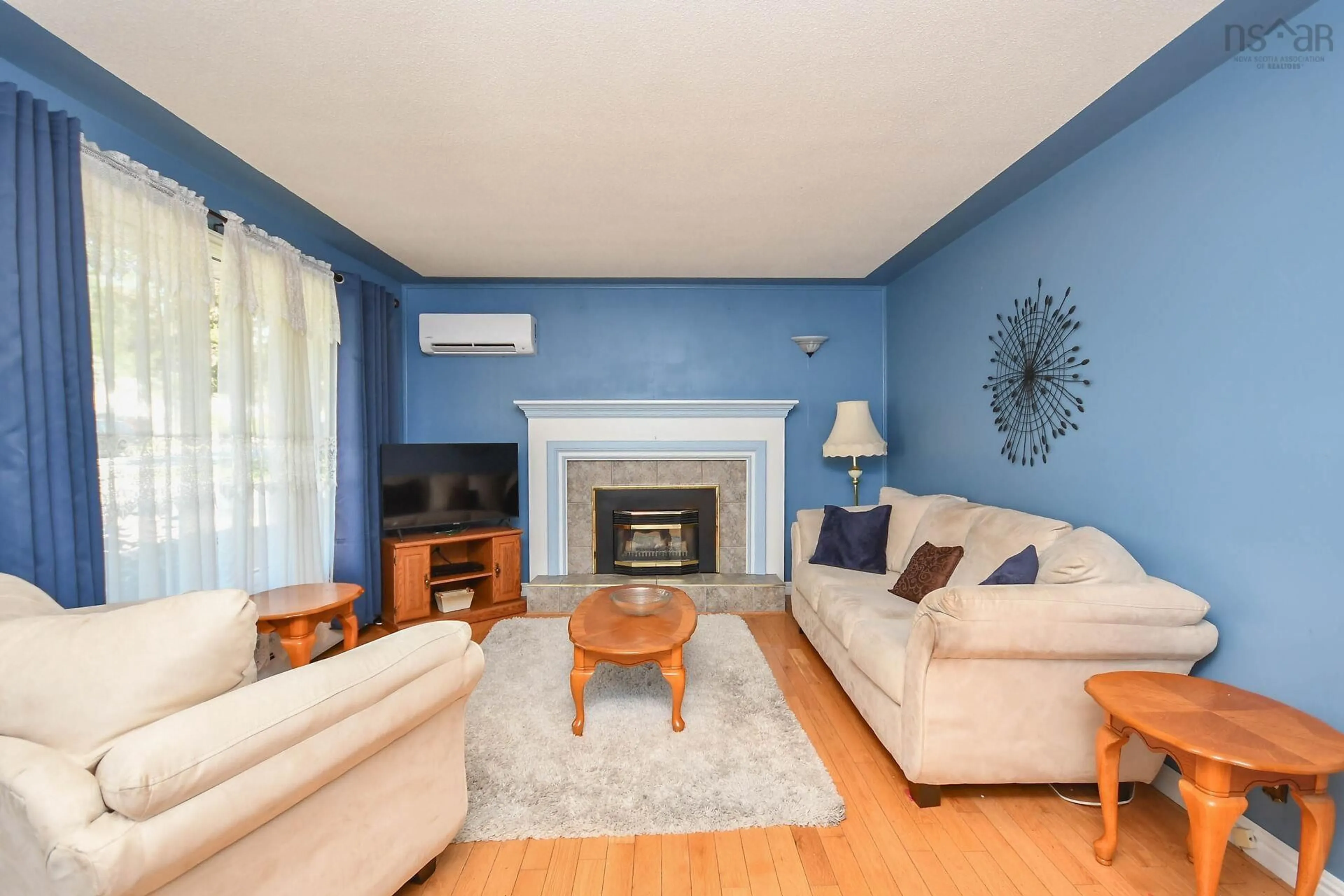Living room with furniture, wood/laminate floor for 80 Beaumont Dr, Lower Sackville Nova Scotia B4C 1V6