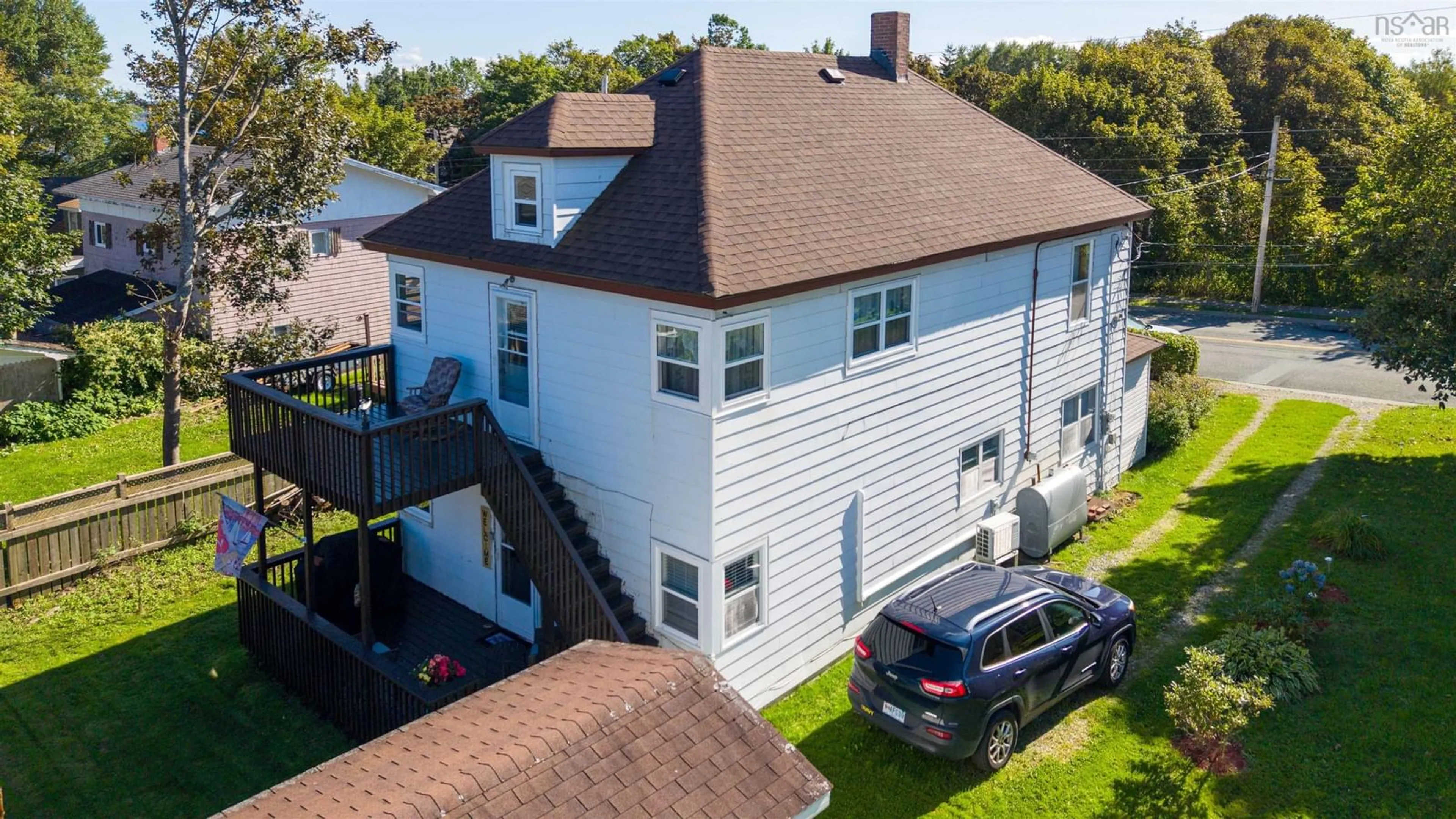 A pic from outside/outdoor area/front of a property/back of a property/a pic from drone, unknown for 530 Main St, Sydney Mines Nova Scotia B1V 2K6