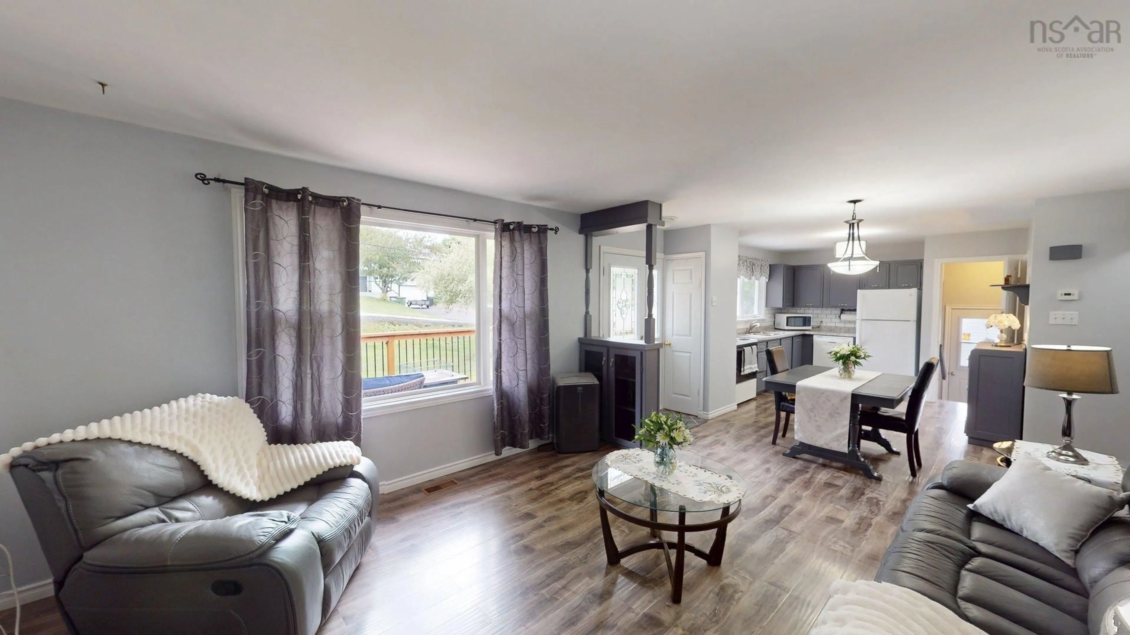 Living room with furniture, wood/laminate floor for 89 Nelson Dr, Lower Sackville Nova Scotia B4C 2A1