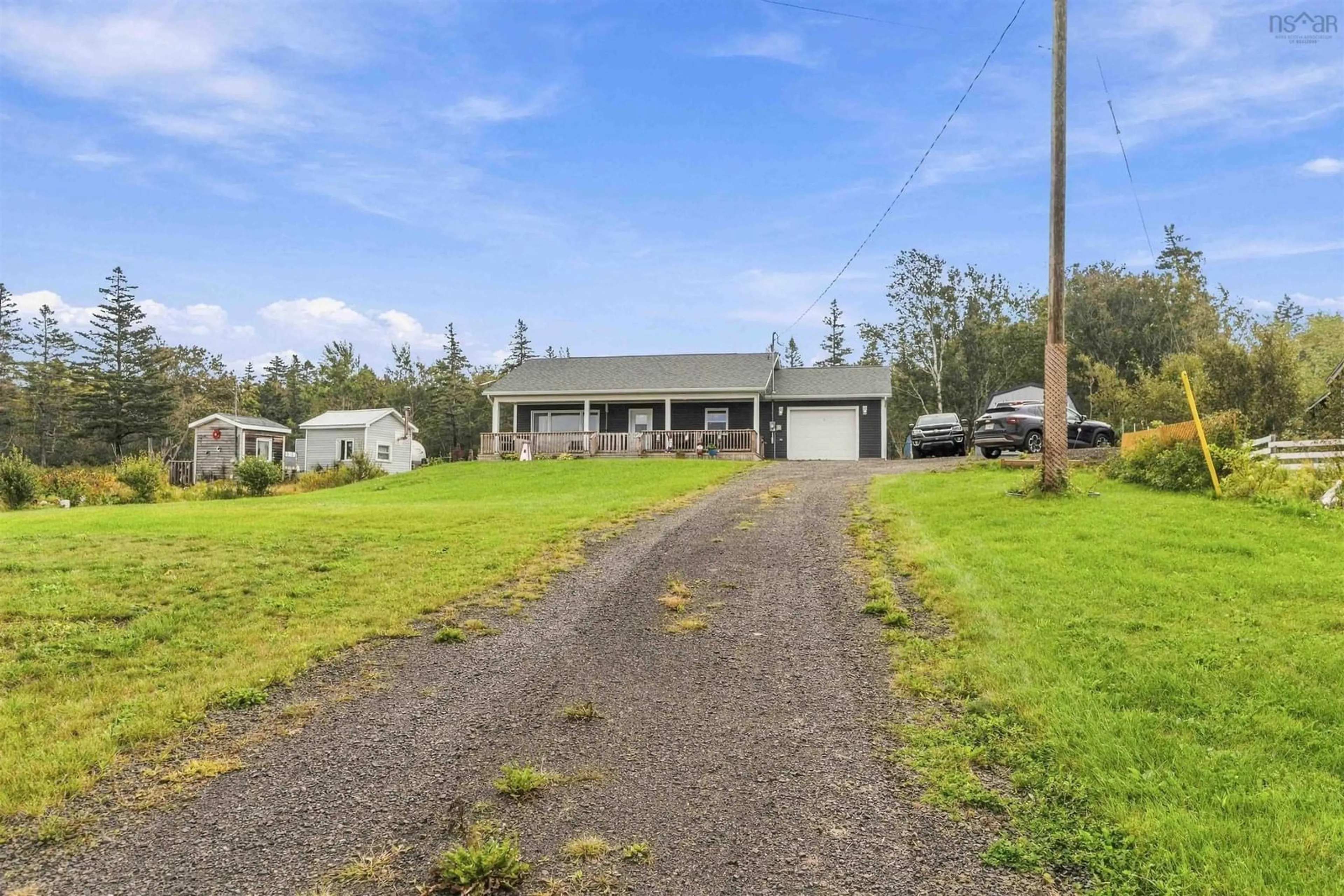A pic from outside/outdoor area/front of a property/back of a property/a pic from drone, street for 12044 Shore Rd, Cottage Cove Nova Scotia B0S 1P0