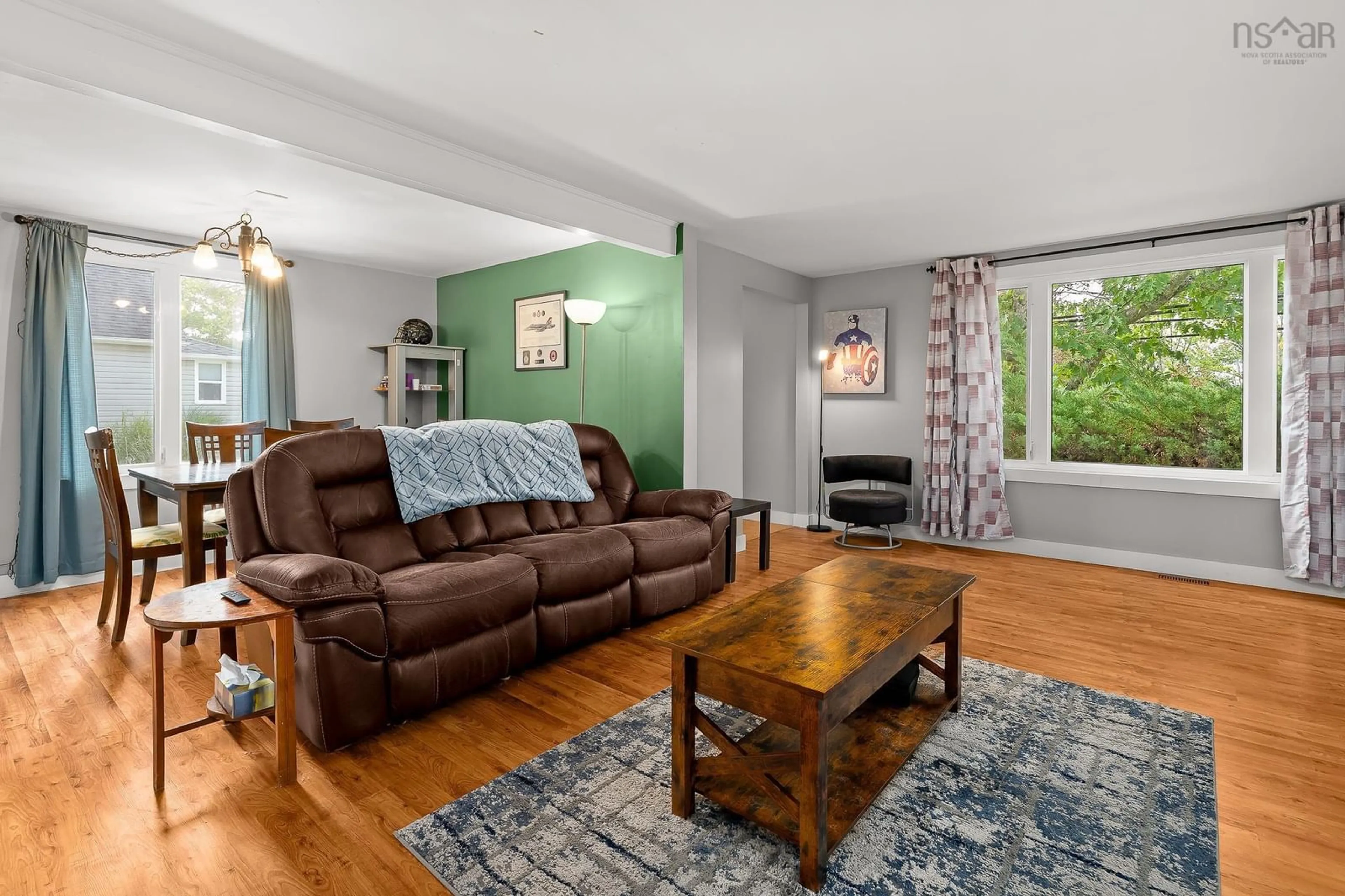 Living room with furniture, wood/laminate floor for 114 Kitchener St, Stewiacke Nova Scotia B0N 2J0