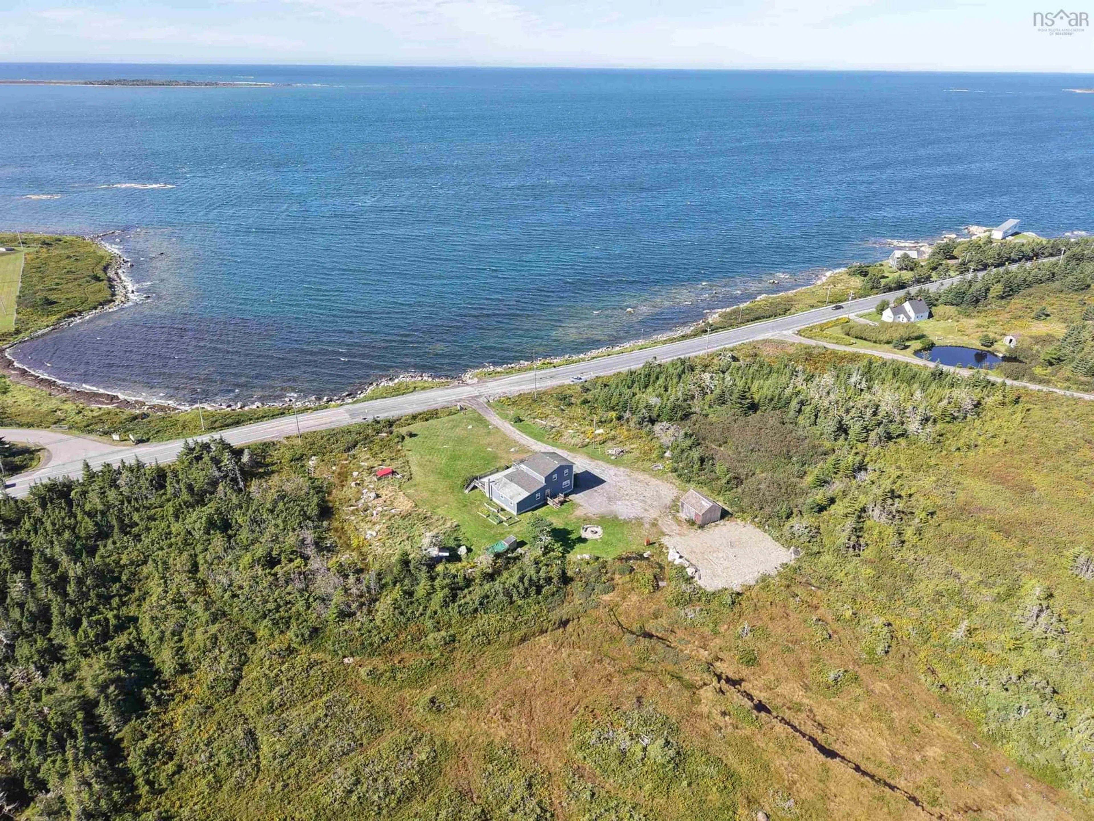 A pic from outside/outdoor area/front of a property/back of a property/a pic from drone, water/lake/river/ocean view for 5966 Highway 3, Shag Harbour Nova Scotia B0W 2B0