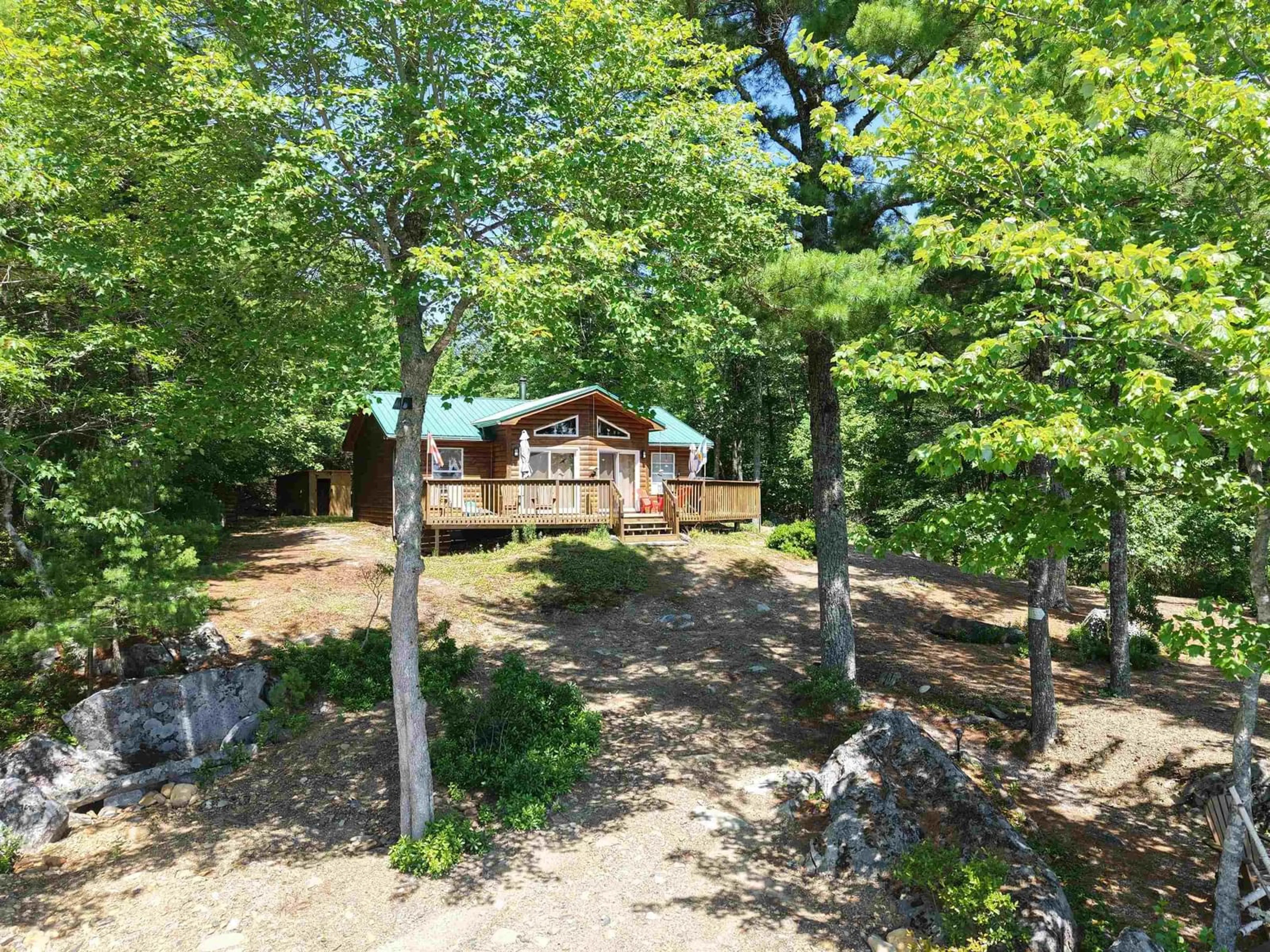 A pic from outside/outdoor area/front of a property/back of a property/a pic from drone, forest/trees view for 21 Babbling Brook Rd, Labelle Nova Scotia B0T 1E0
