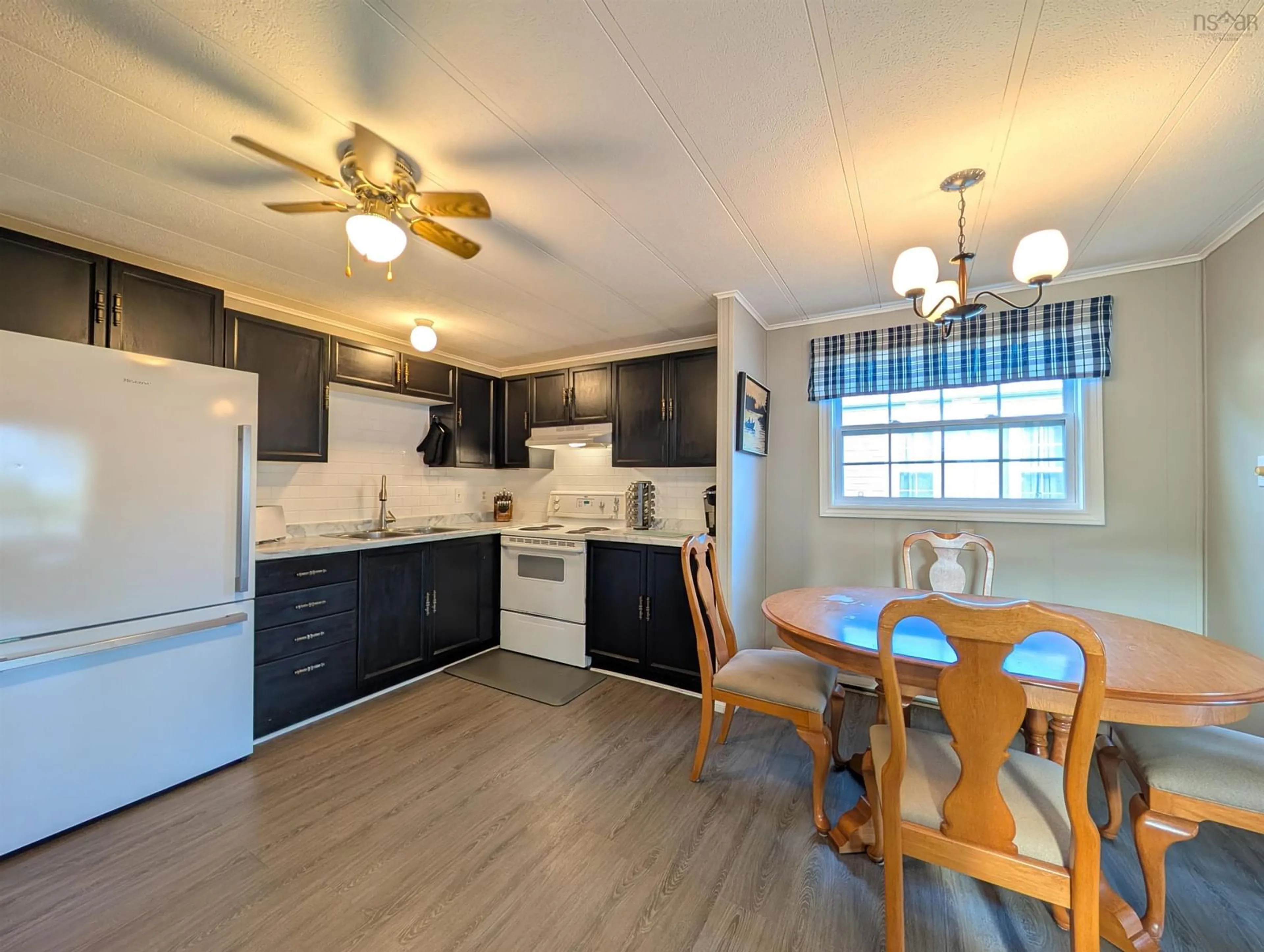 Open concept kitchen, wood/laminate floor for 29 Broadway St, Lakeside Nova Scotia B3T 1B1