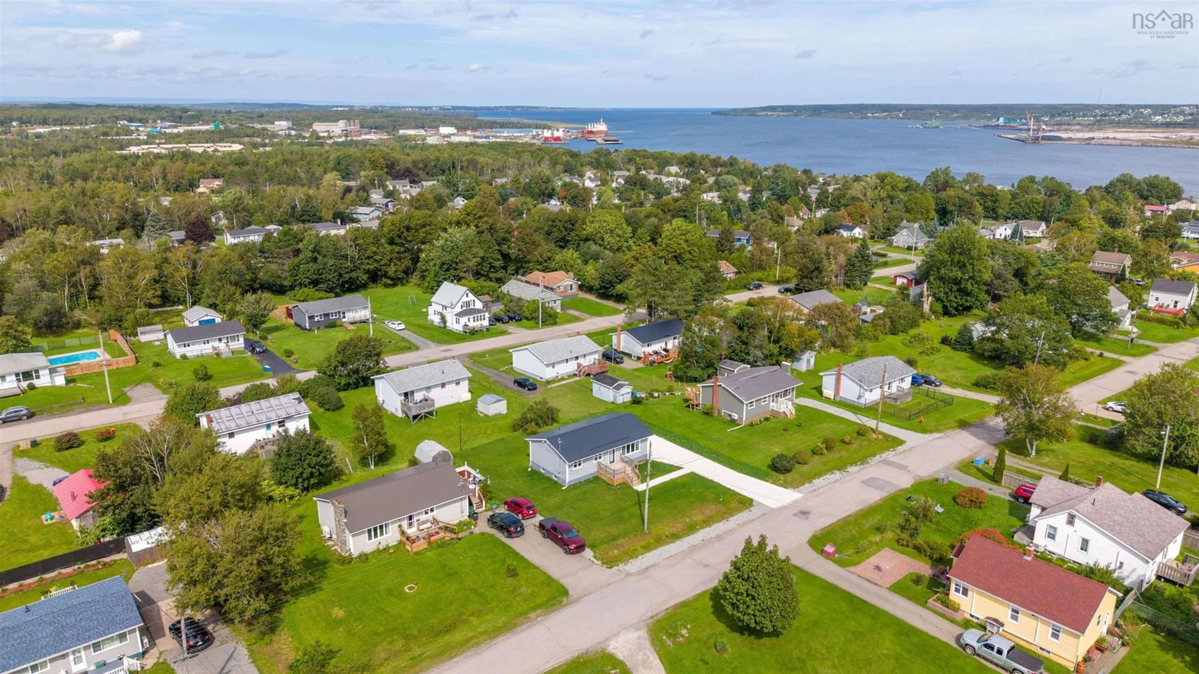 A pic from outside/outdoor area/front of a property/back of a property/a pic from drone, water/lake/river/ocean view for 162 Monteith Ave, Westmount Nova Scotia B1J 1P4
