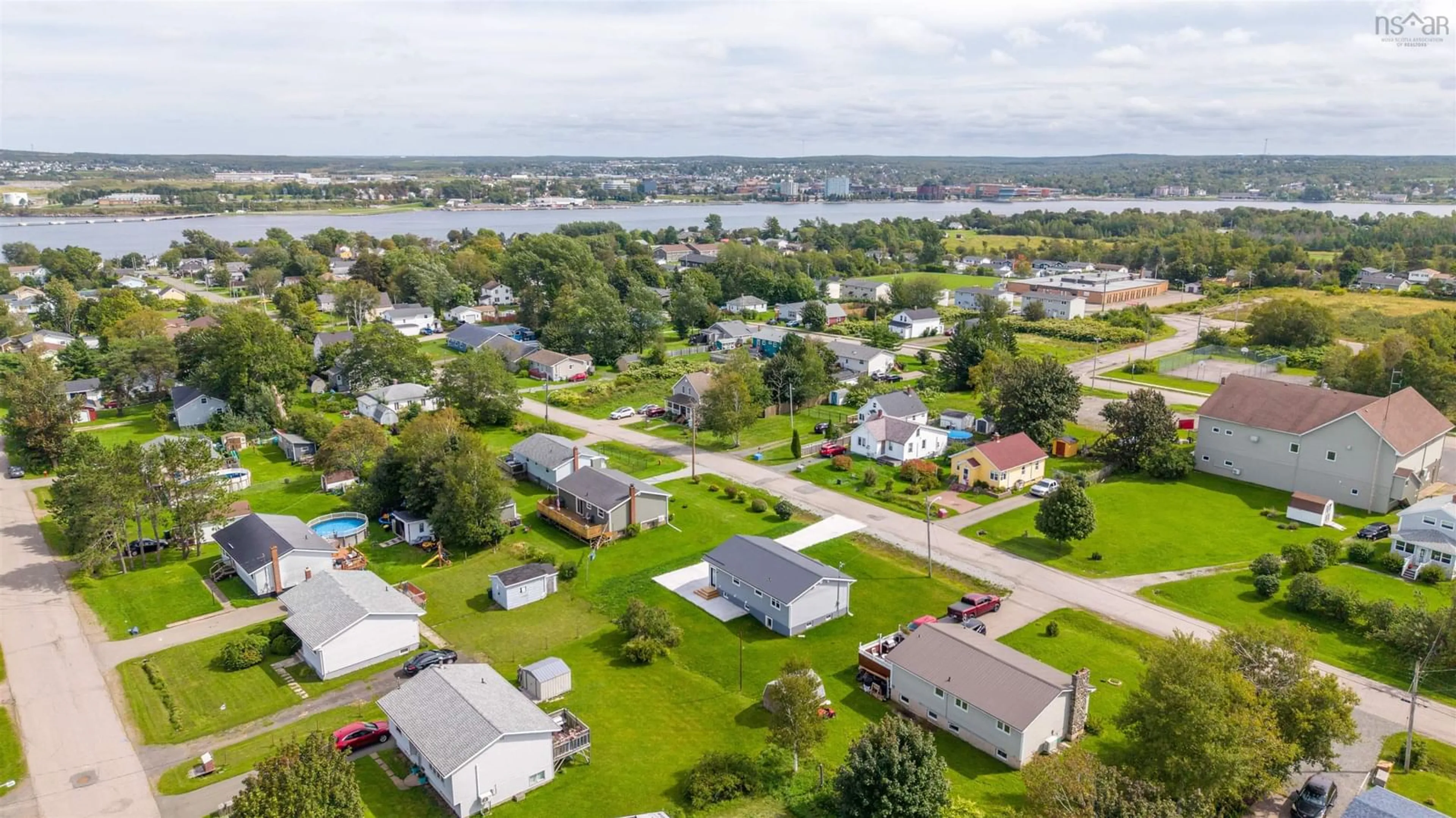 A pic from outside/outdoor area/front of a property/back of a property/a pic from drone, water/lake/river/ocean view for 162 Monteith Ave, Westmount Nova Scotia B1J 1P4