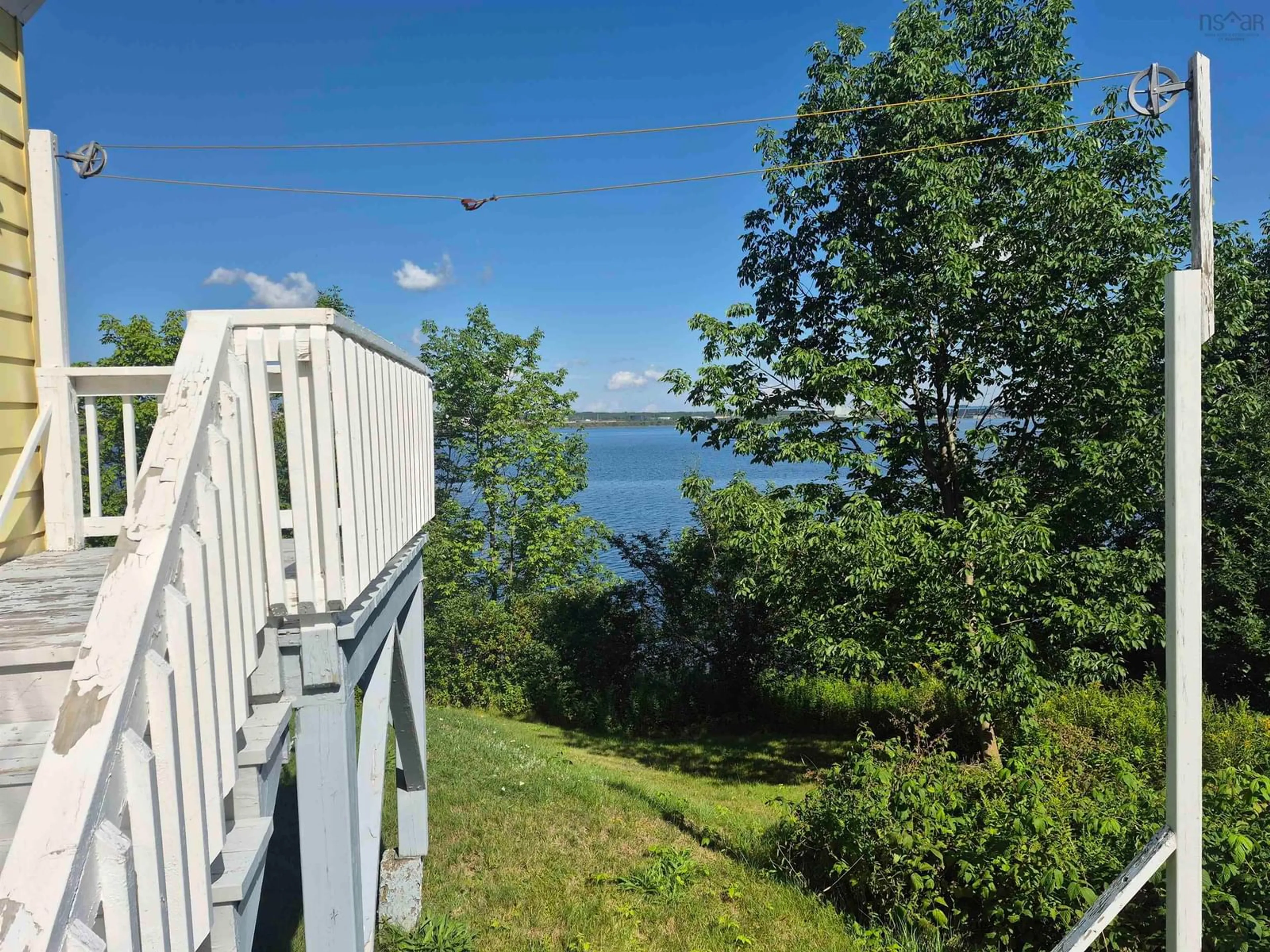 A pic from outside/outdoor area/front of a property/back of a property/a pic from drone, water/lake/river/ocean view for 650 Main St, Mulgrave Nova Scotia B0E 2G0