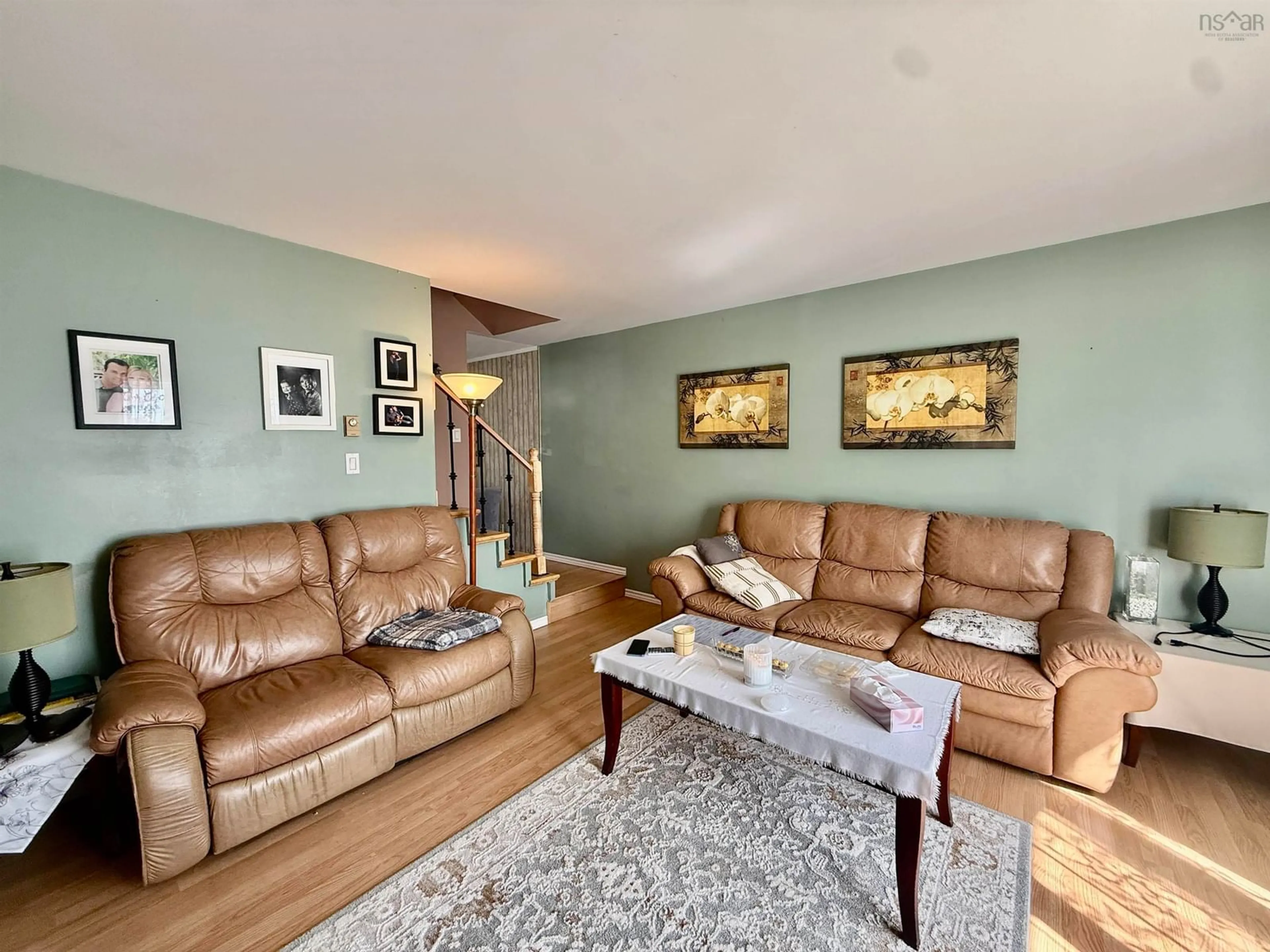 Living room with furniture, wood/laminate floor for 27 Malik Crt, Lower Sackville Nova Scotia B4C 3V8