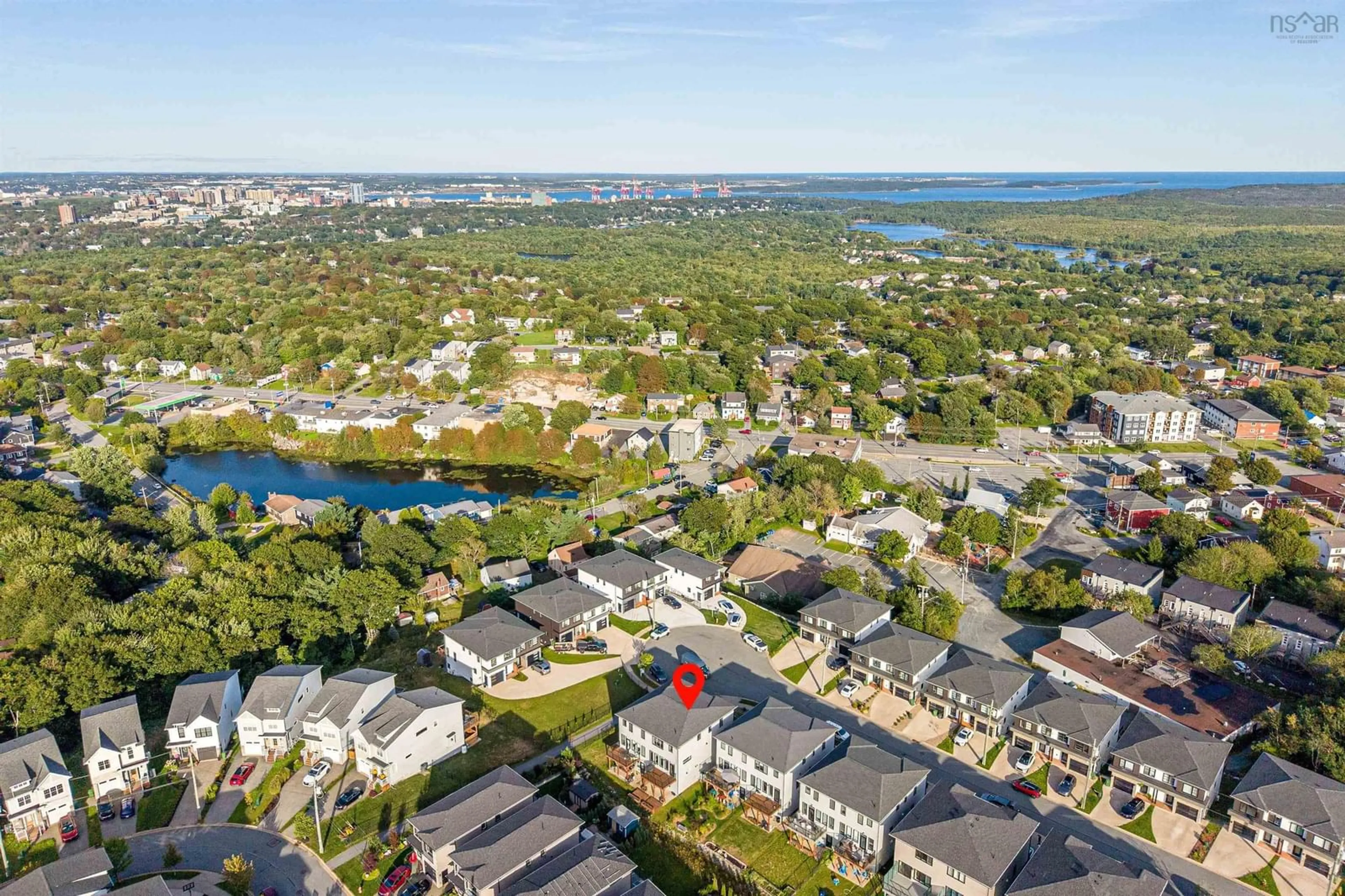A pic from outside/outdoor area/front of a property/back of a property/a pic from drone, water/lake/river/ocean view for 60 Grenoble Crt, Halifax Nova Scotia B3P 0J7