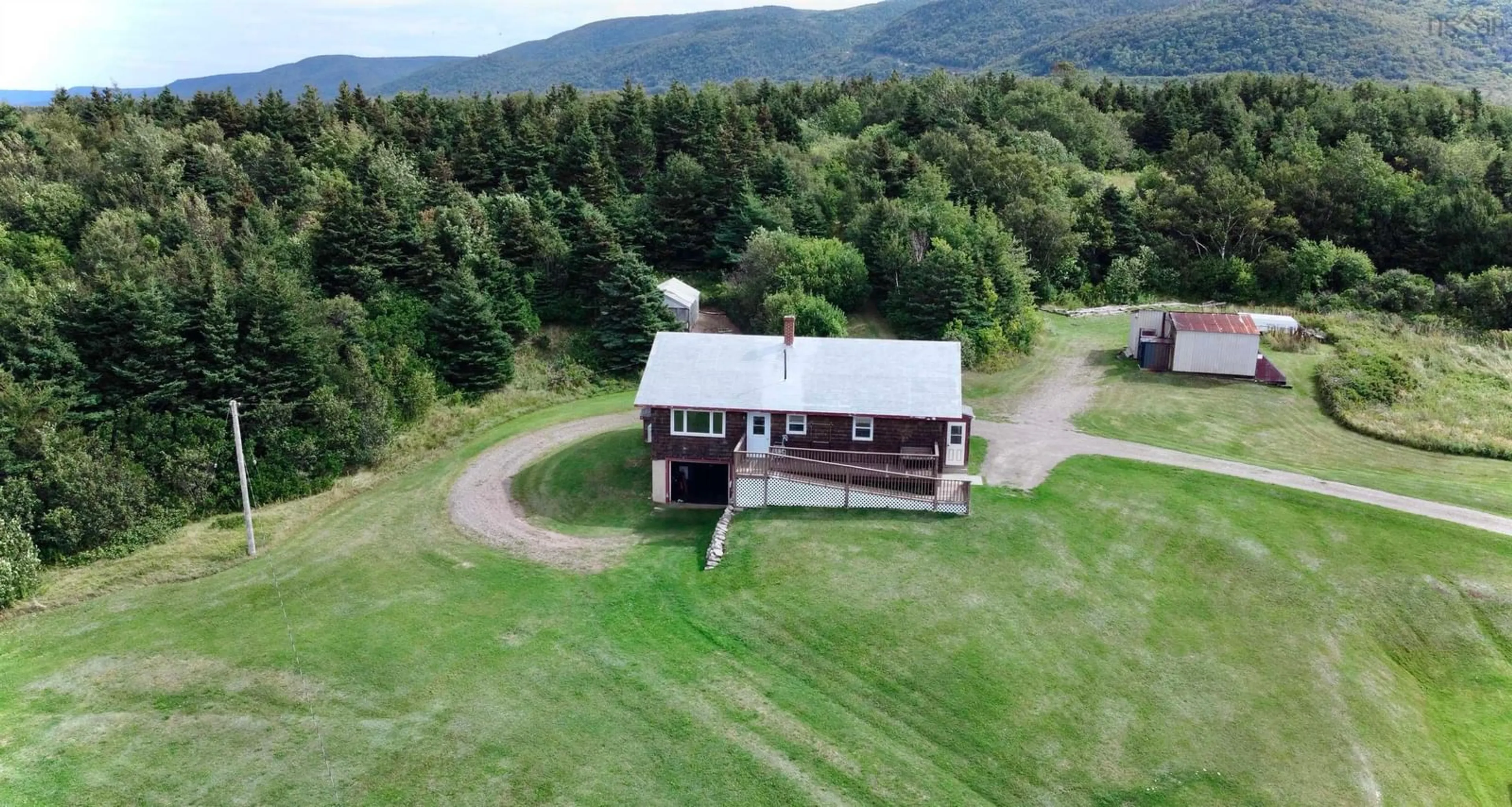 A pic from outside/outdoor area/front of a property/back of a property/a pic from drone, mountain view for 14086 Cabot Trail, Chéticamp Nova Scotia B0E 1H0