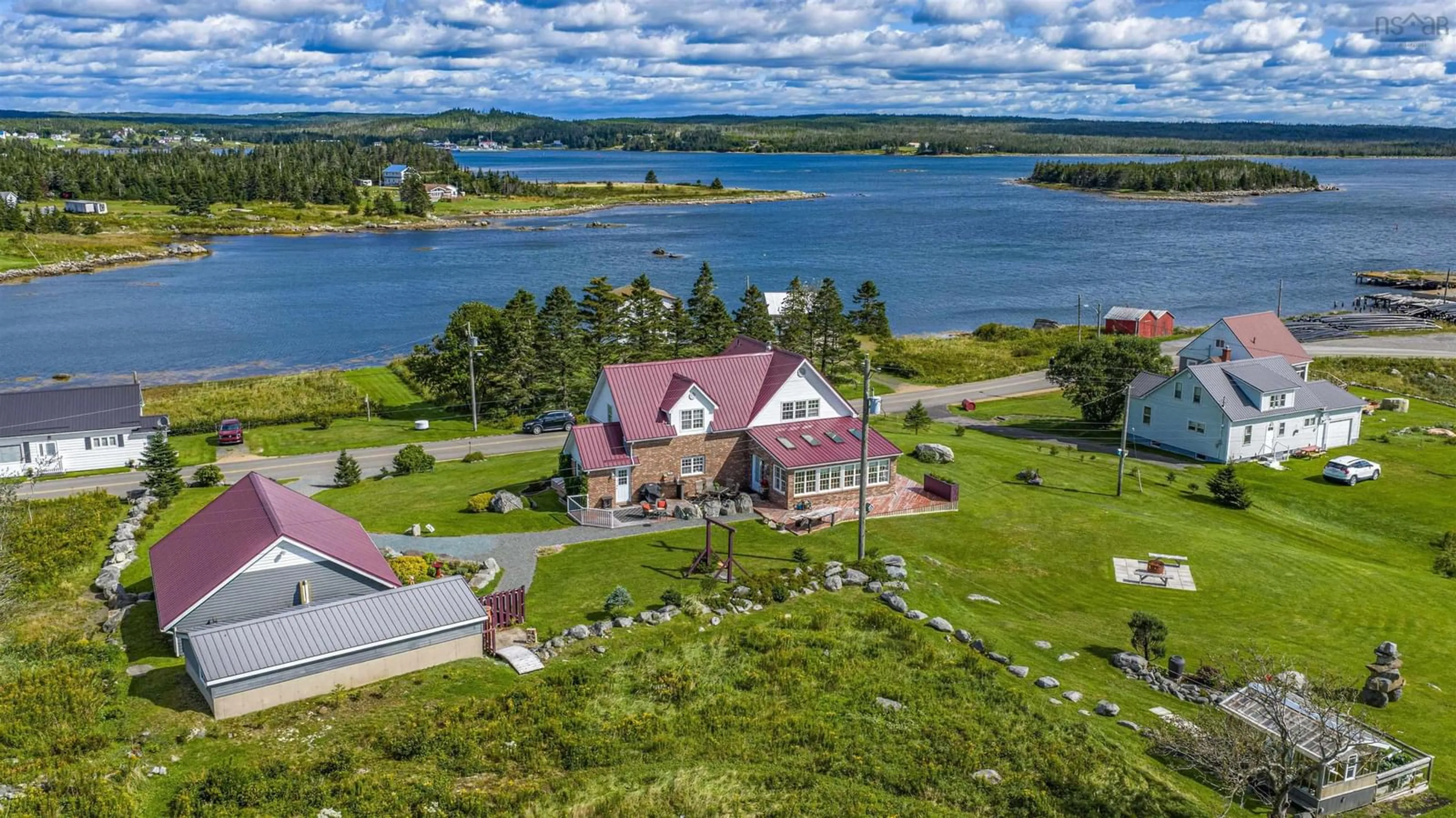 A pic from outside/outdoor area/front of a property/back of a property/a pic from drone, water/lake/river/ocean view for 18 Harbourview Dr, Port Bickerton Nova Scotia B0J 1A0