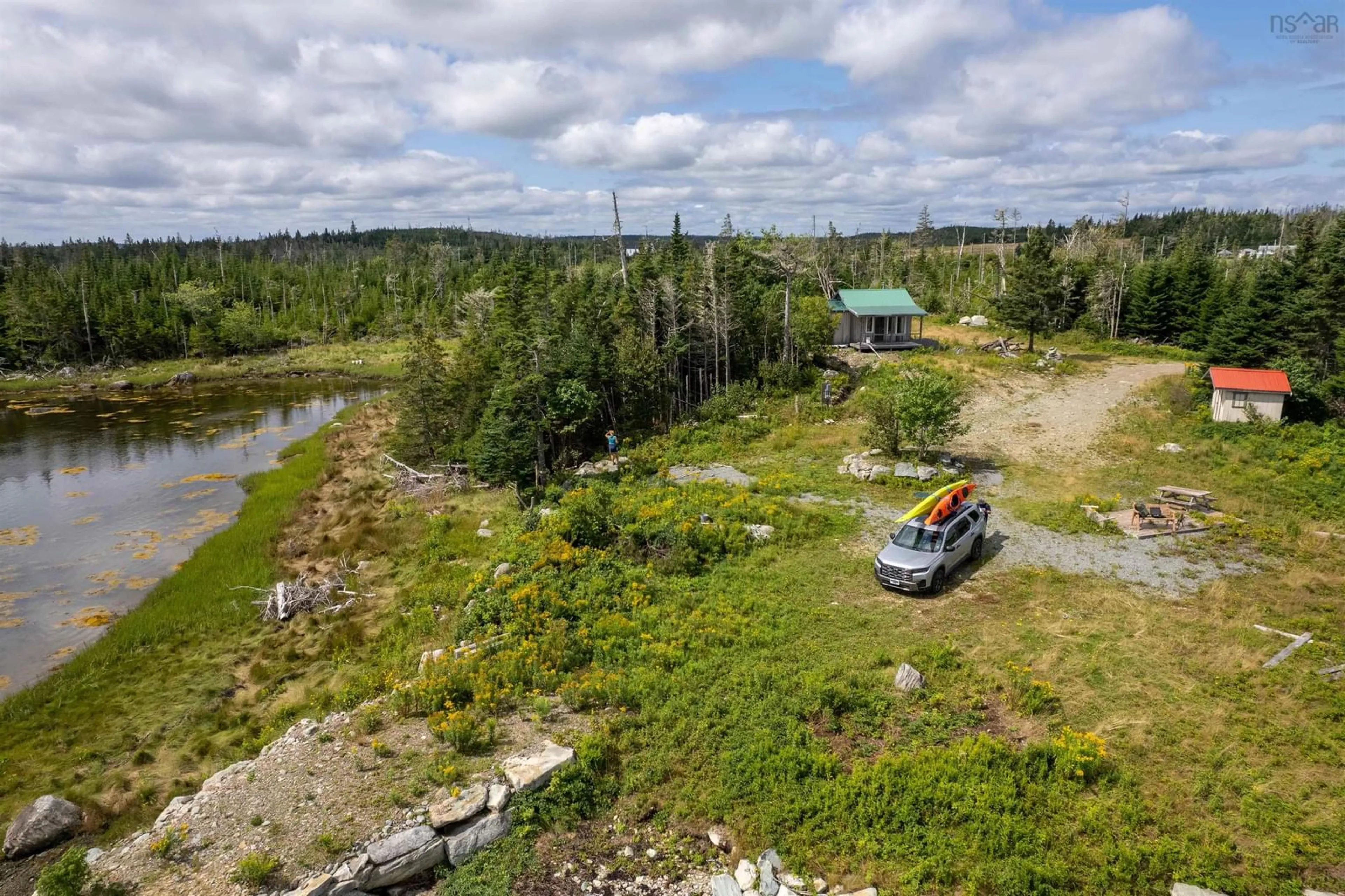A pic from outside/outdoor area/front of a property/back of a property/a pic from drone, water/lake/river/ocean view for 27376 Highway 7, Harrigan Cove Nova Scotia B0J 2K0