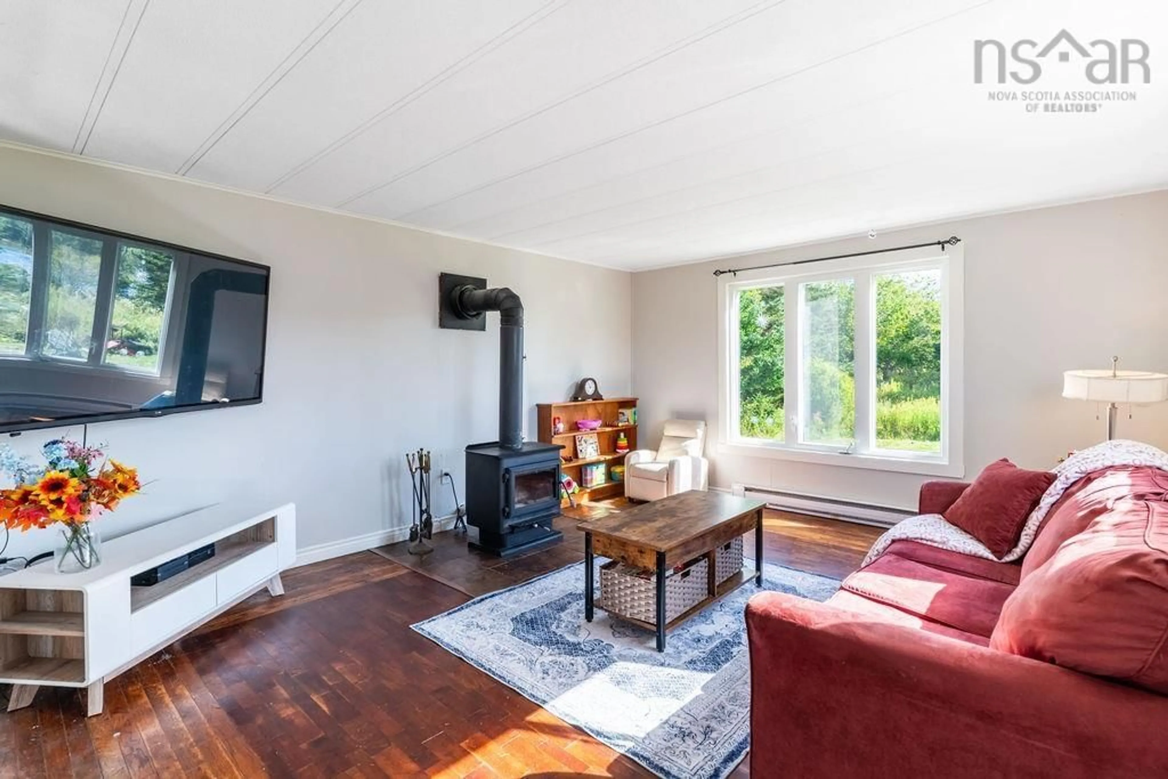 Living room with furniture, wood/laminate floor for 76 Serendipity Lane, Musquodoboit Harbour Nova Scotia B0J 2L0