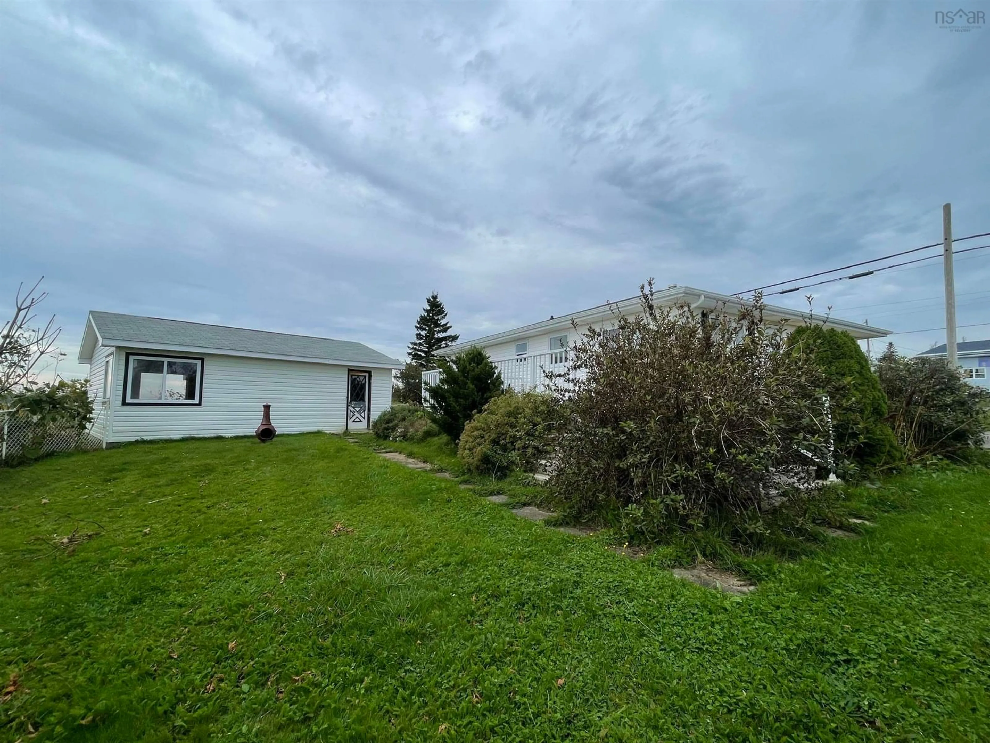 A pic from outside/outdoor area/front of a property/back of a property/a pic from drone, unknown for 2833 Highway 255, Port Morien Nova Scotia B1B 1V9