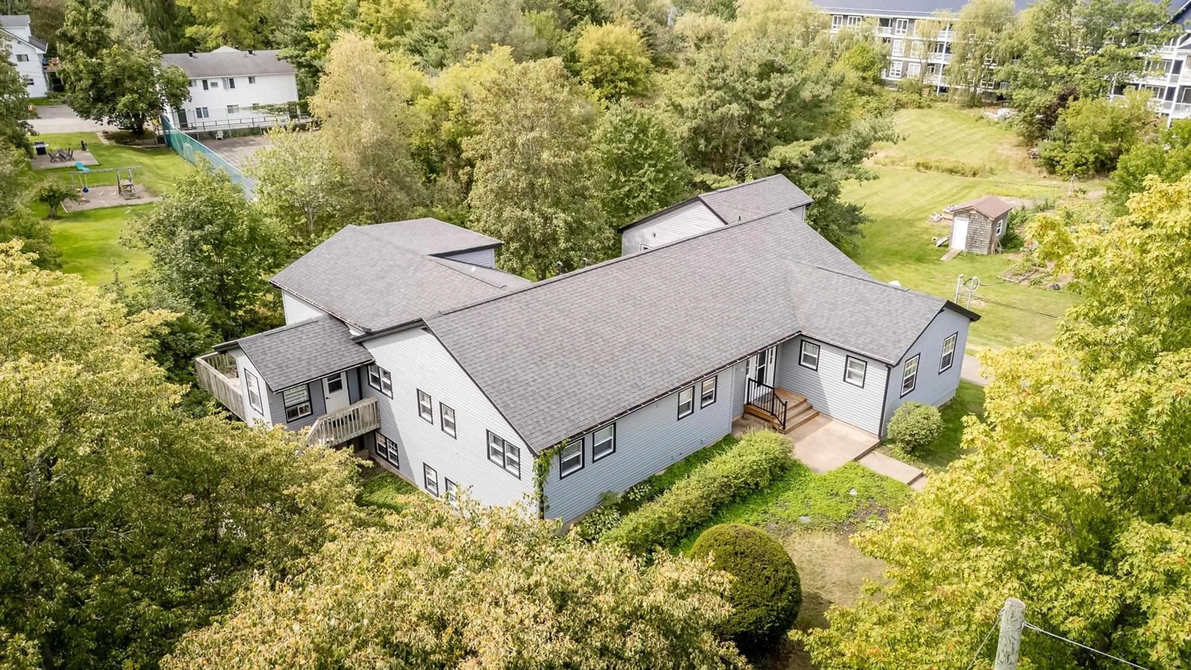 A pic from outside/outdoor area/front of a property/back of a property/a pic from drone, building for 18 Woodman Rd, Wolfville Nova Scotia B4P 2M5