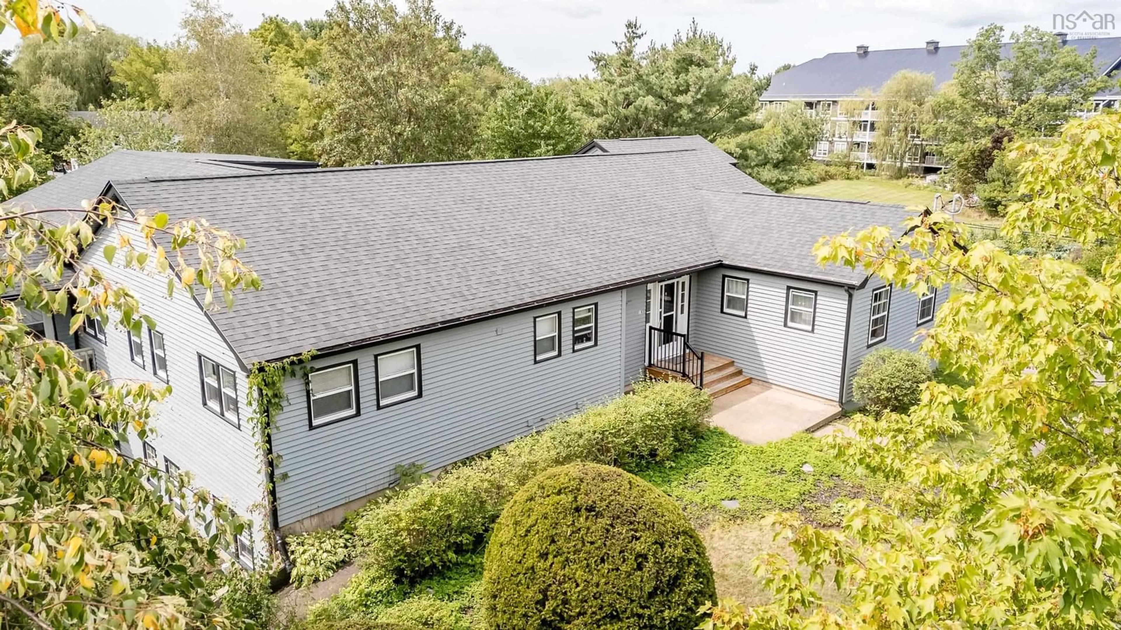 A pic from outside/outdoor area/front of a property/back of a property/a pic from drone, unknown for 18 Woodman Rd, Wolfville Nova Scotia B4P 2M5