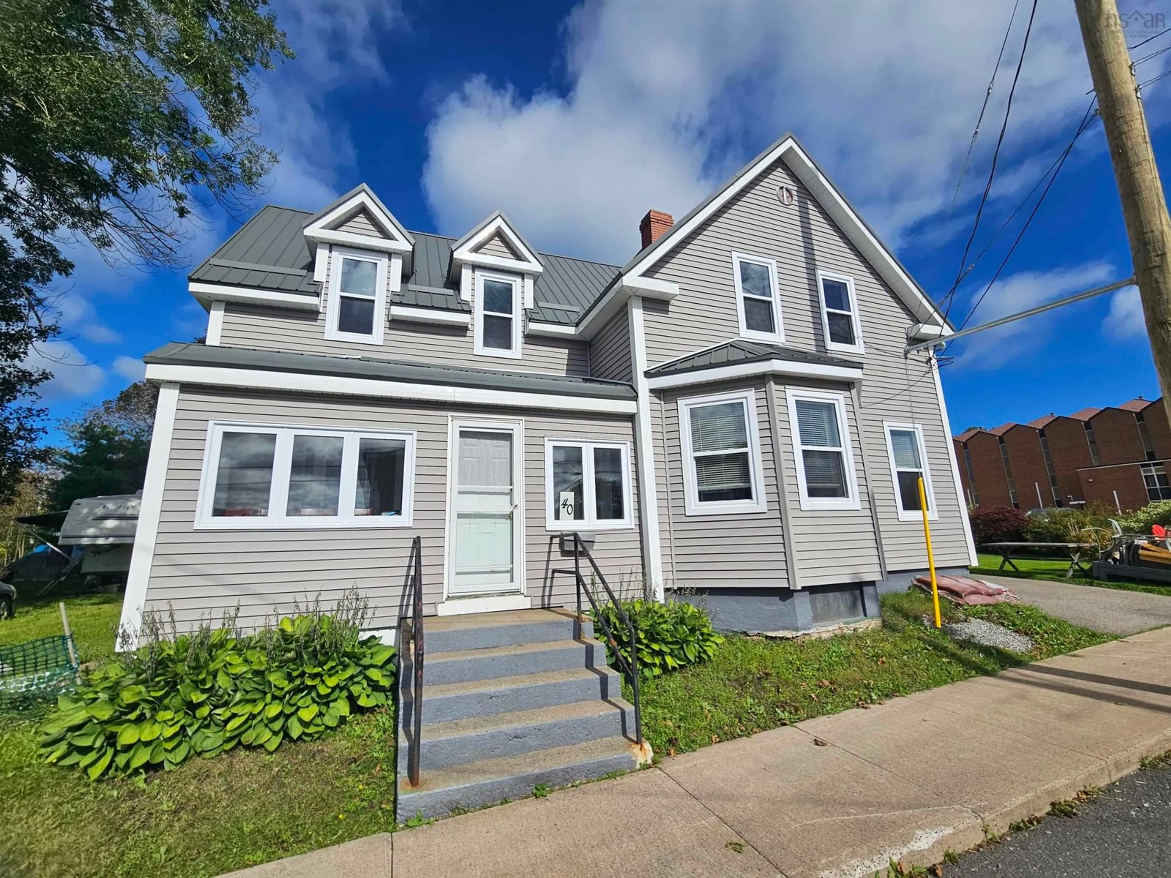Home with vinyl exterior material, street for 40 Pleasant St, North Sydney Nova Scotia B2A 1K9