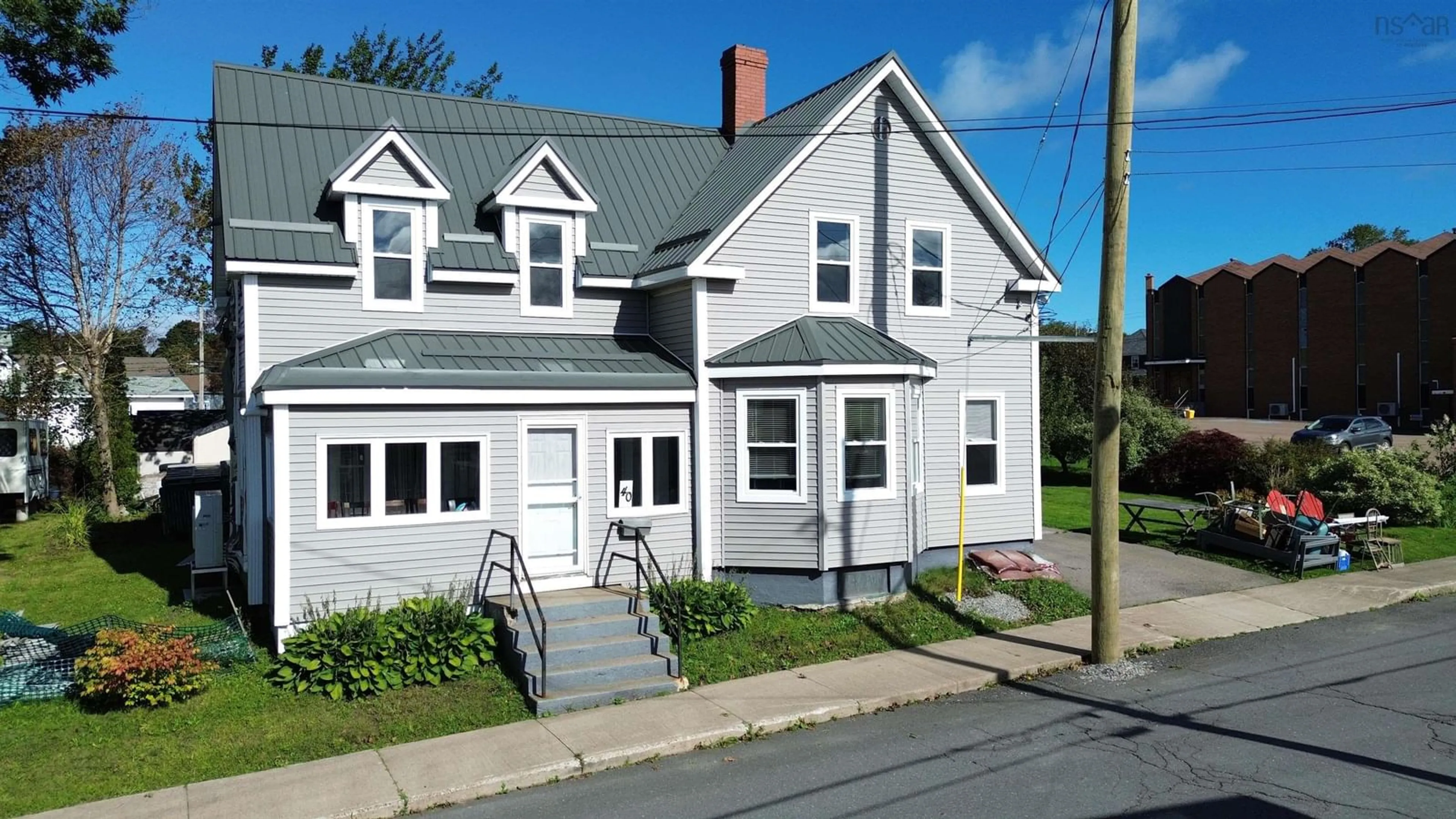 Home with vinyl exterior material, street for 40 Pleasant St, North Sydney Nova Scotia B2A 1K9