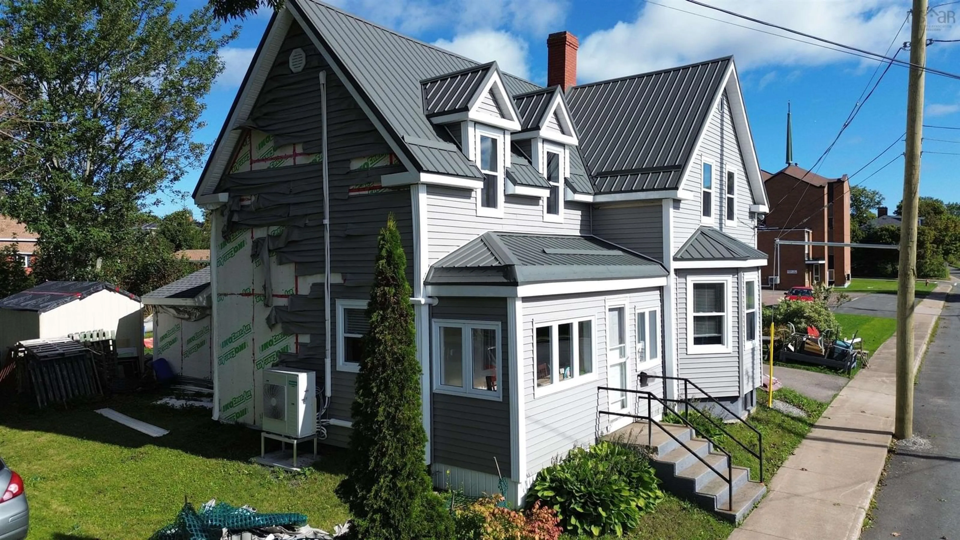 Home with vinyl exterior material, street for 40 Pleasant St, North Sydney Nova Scotia B2A 1K9