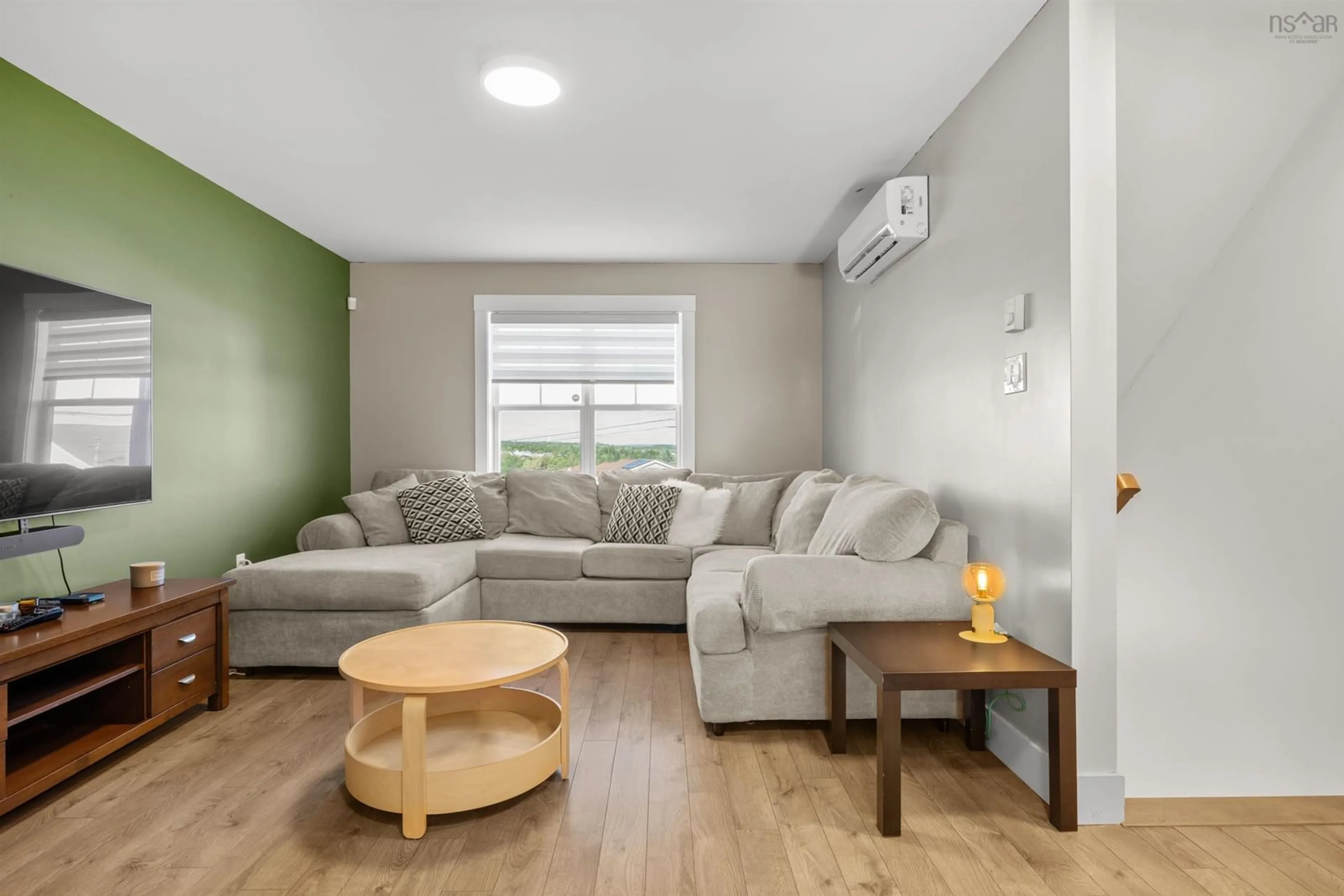 Living room with furniture, wood/laminate floor for 81 Fescue Crt, Middle Sackville Nova Scotia B4E 0L7