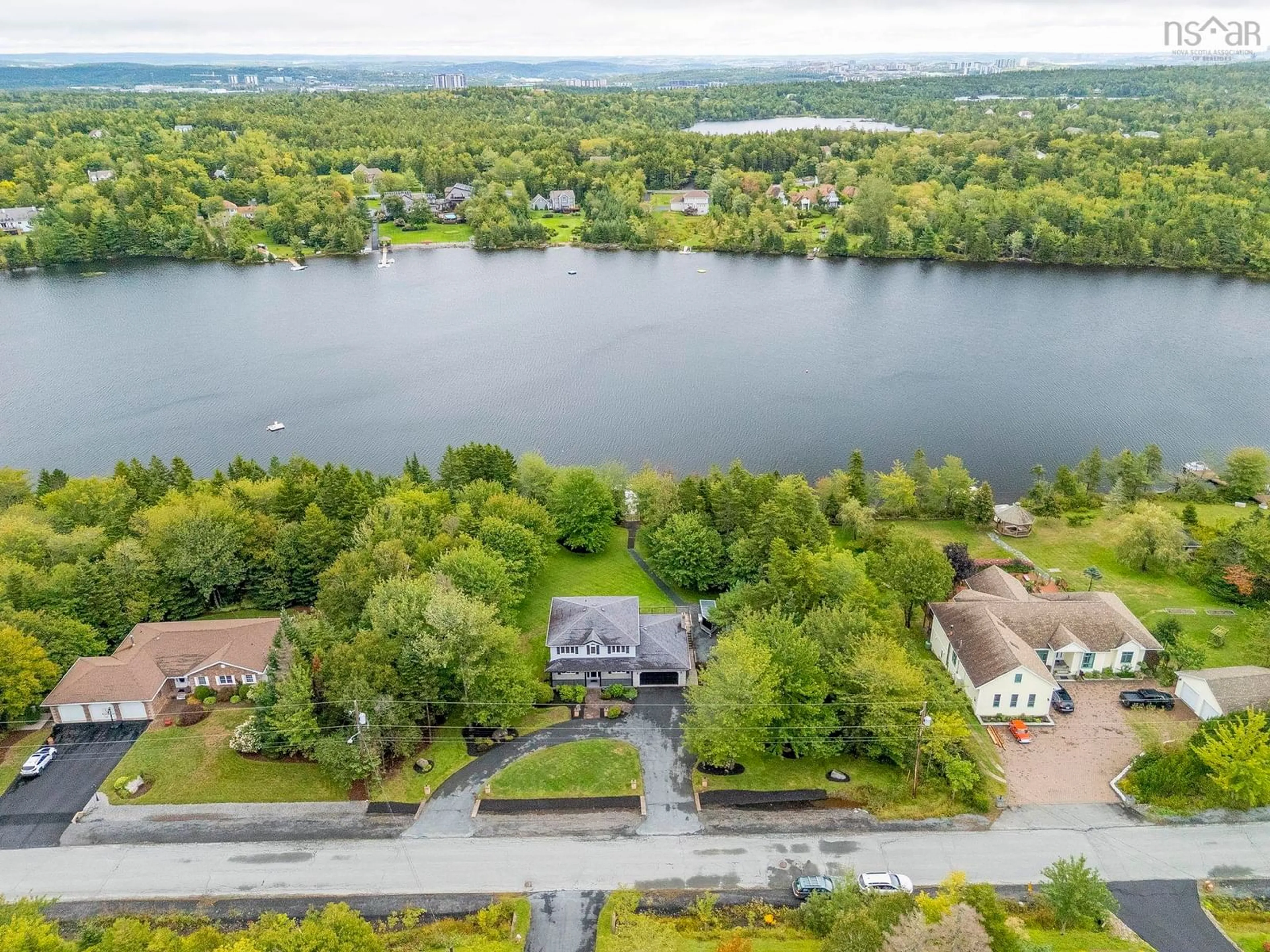 A pic from outside/outdoor area/front of a property/back of a property/a pic from drone, water/lake/river/ocean view for 58 Lakefront Dr, Hammonds Plains Nova Scotia B4B 1L4