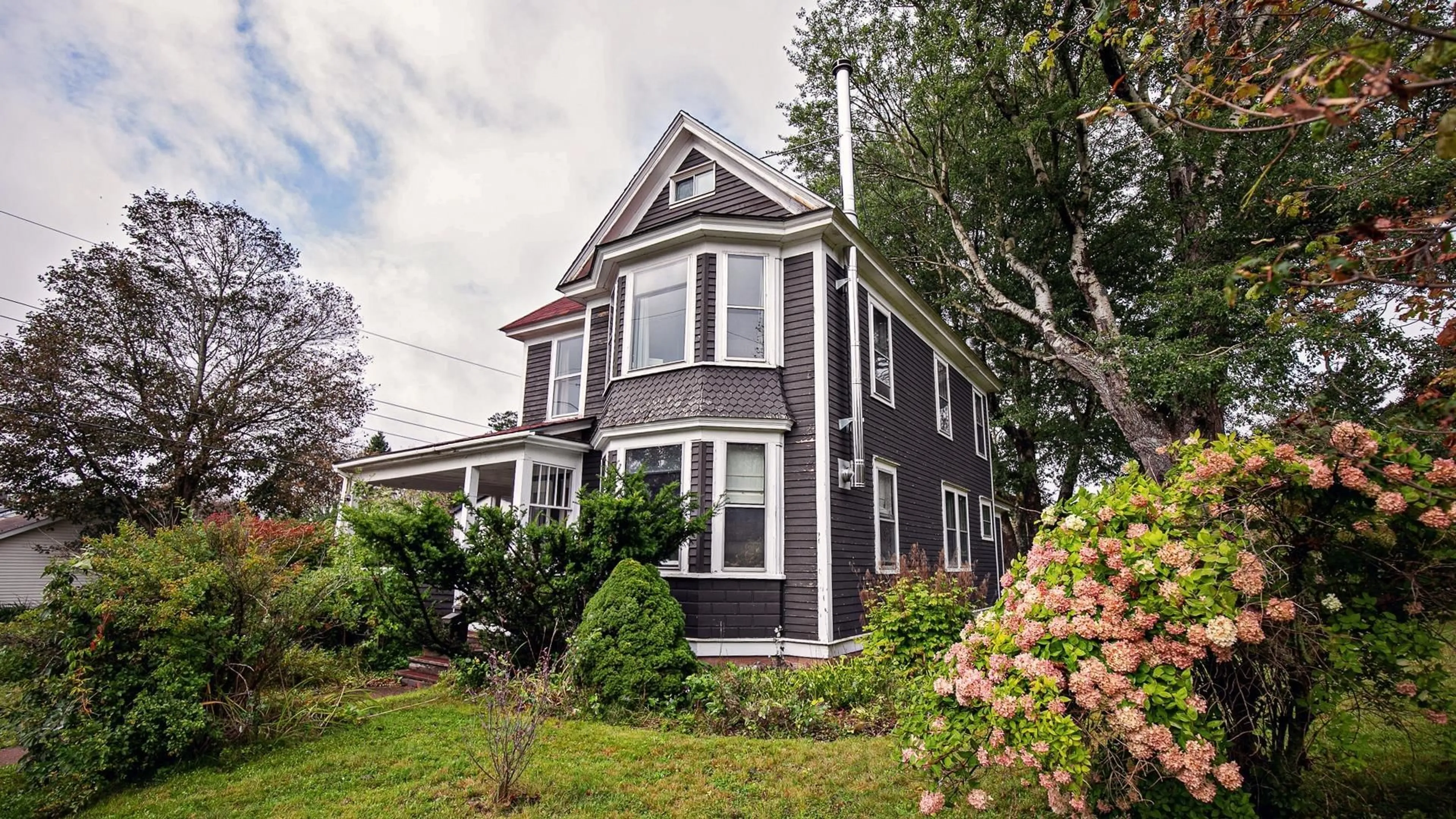 Home with vinyl exterior material, street for 61 Victoria St, Amherst Nova Scotia B4H 1C3