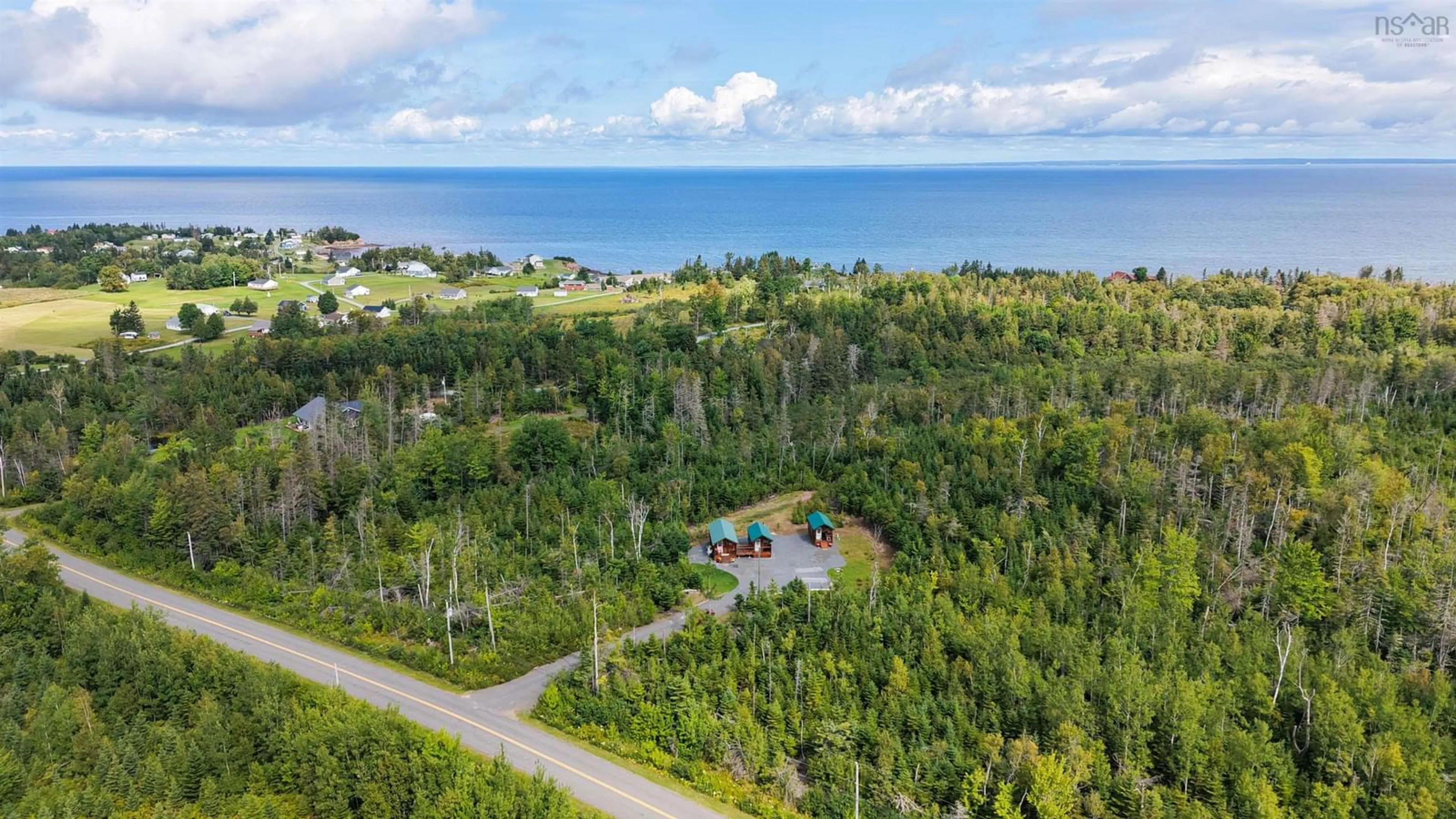 A pic from outside/outdoor area/front of a property/back of a property/a pic from drone, water/lake/river/ocean view for 359 Shore Rd, Caribou River Nova Scotia B0K 1H0