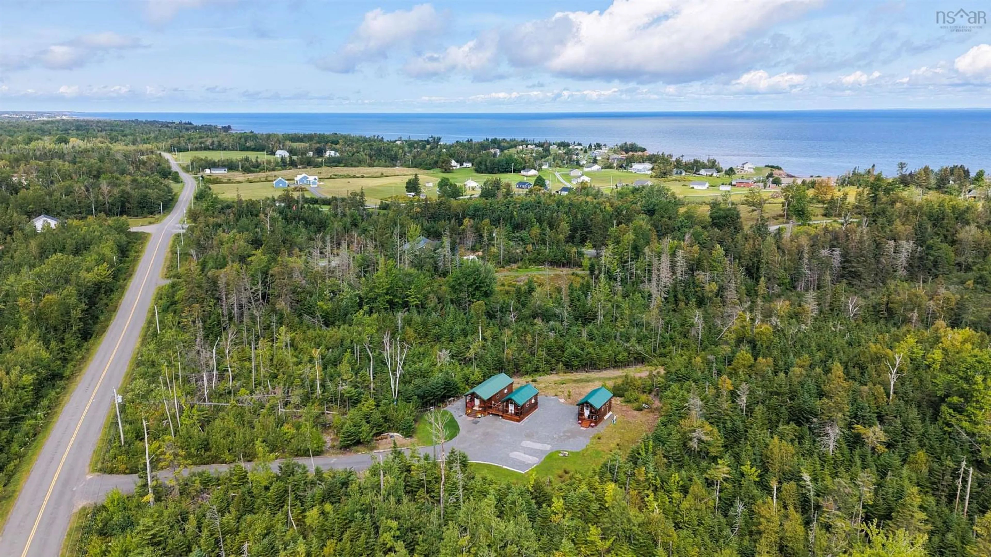 A pic from outside/outdoor area/front of a property/back of a property/a pic from drone, water/lake/river/ocean view for 359 Shore Rd, Caribou River Nova Scotia B0K 1H0