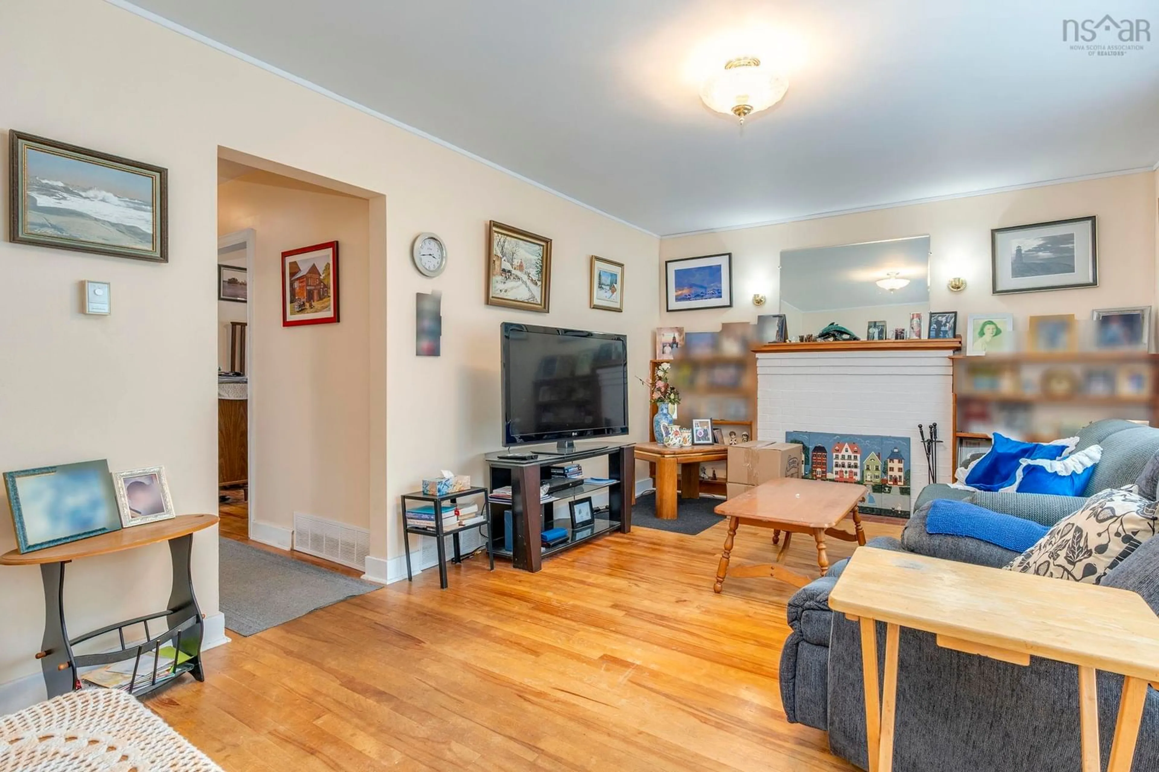 Living room with furniture, wood/laminate floor for 31 Auburn Ave, Halifax Nova Scotia B3R 1K4