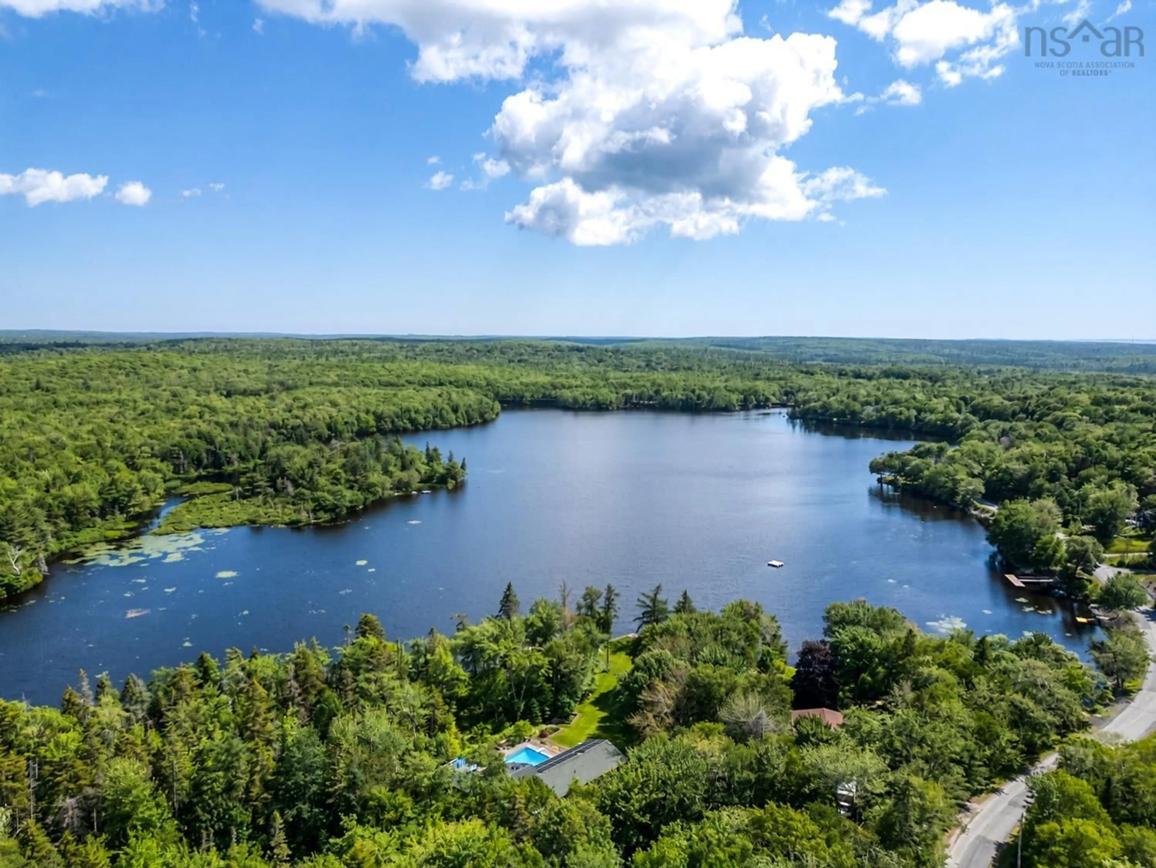 A pic from outside/outdoor area/front of a property/back of a property/a pic from drone, water/lake/river/ocean view for 121 Hubley Mill Lake Rd, Upper Tantallon Nova Scotia B3Z 1E8