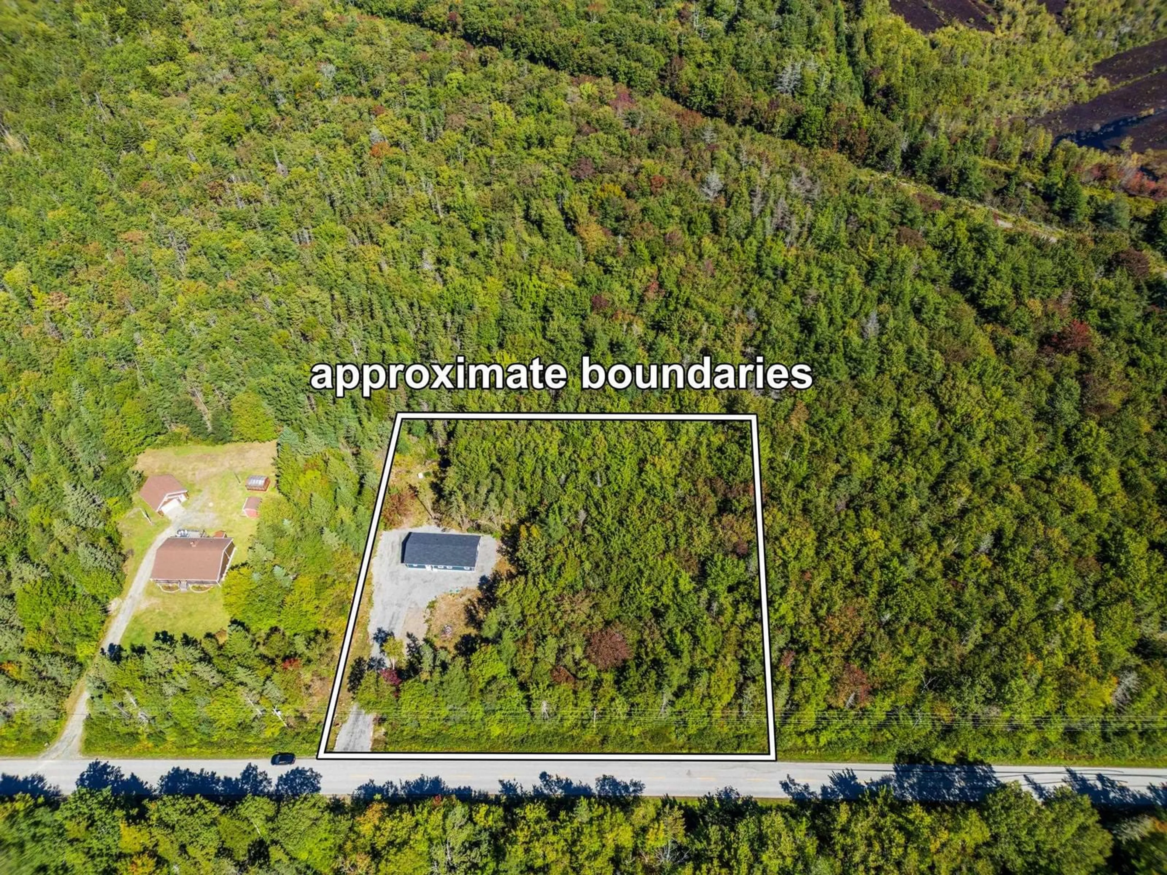 A pic from outside/outdoor area/front of a property/back of a property/a pic from drone, forest/trees view for 1221 D'entremont Road, Meteghan Station Nova Scotia B0W 2L0