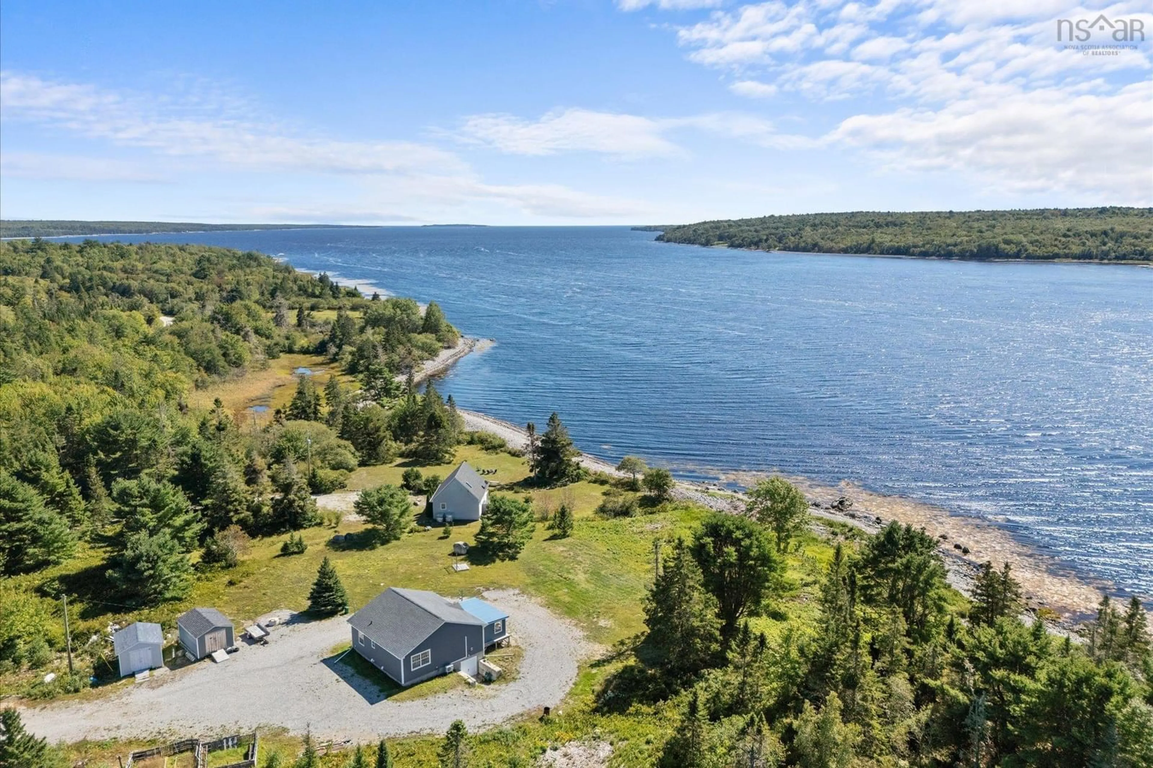 A pic from outside/outdoor area/front of a property/back of a property/a pic from drone, water/lake/river/ocean view for 238 Enslows Point Rd, Jordan Branch Nova Scotia B0T 1J0