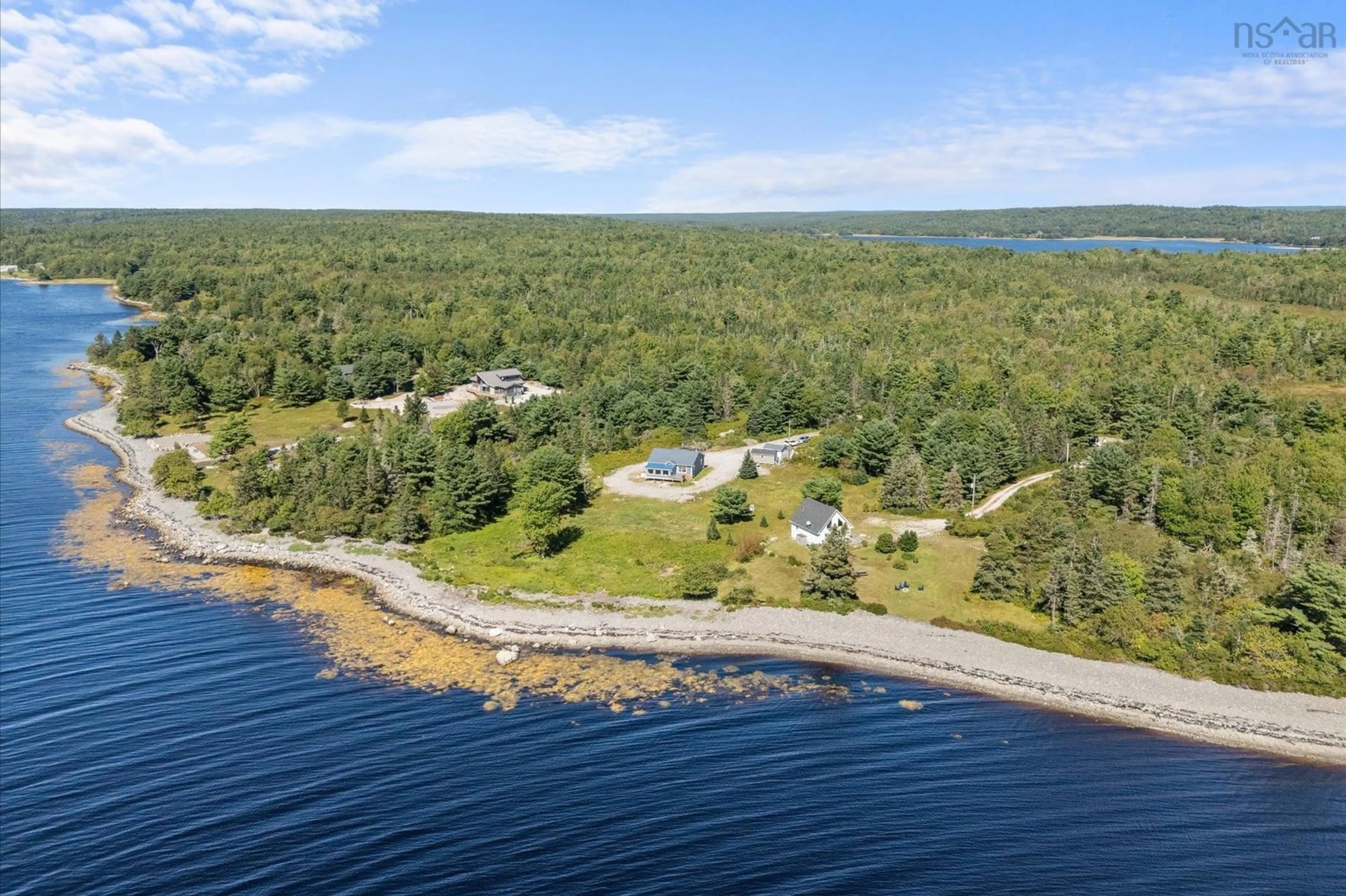 A pic from outside/outdoor area/front of a property/back of a property/a pic from drone, water/lake/river/ocean view for 238 Enslows Point Rd, Jordan Branch Nova Scotia B0T 1J0