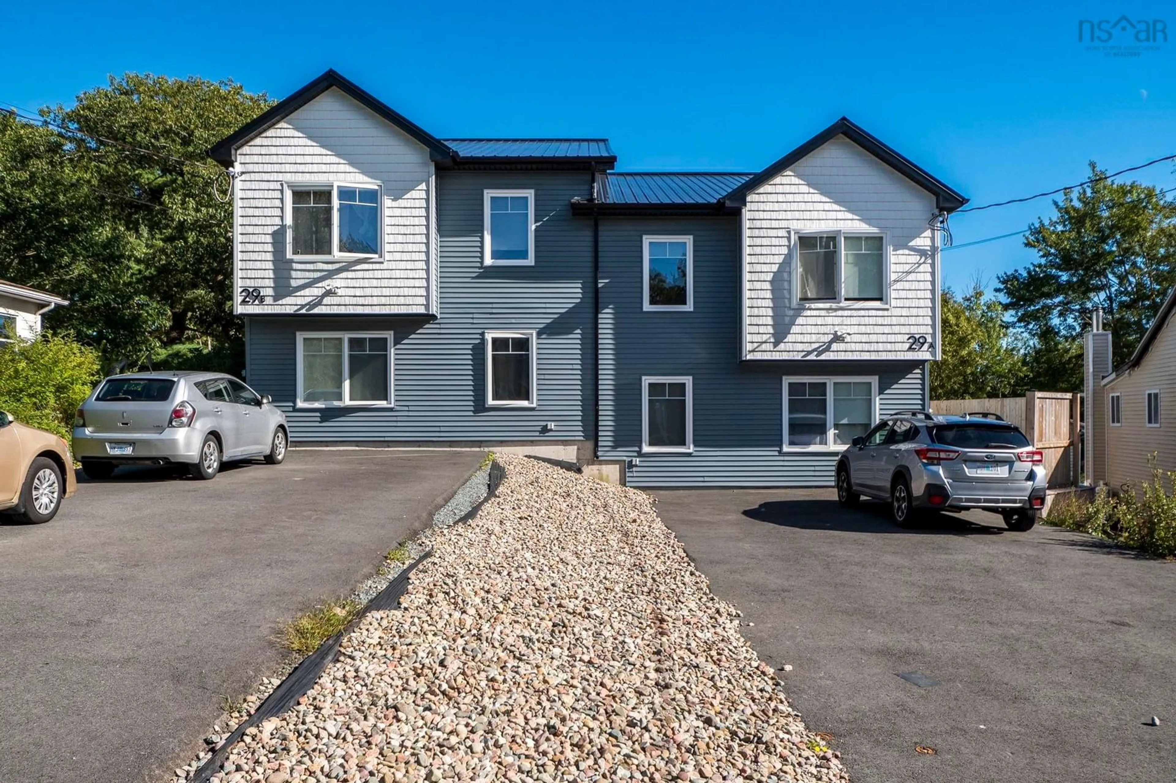 A pic from outside/outdoor area/front of a property/back of a property/a pic from drone, street for 29 Mcintosh St #A/B, Halifax Nova Scotia B3R 1G9