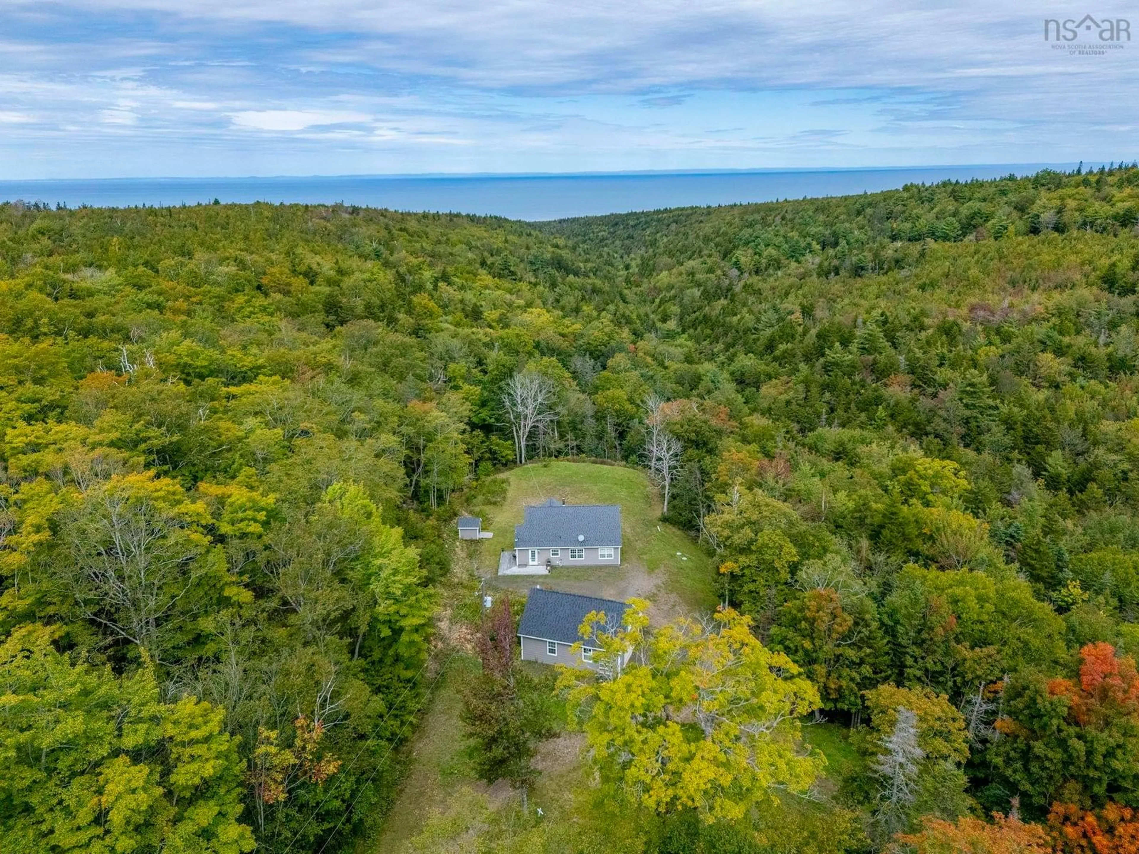 A pic from outside/outdoor area/front of a property/back of a property/a pic from drone, water/lake/river/ocean view for 984 Youngs Mountain Rd, Youngs Cove Nova Scotia B0S 1L0