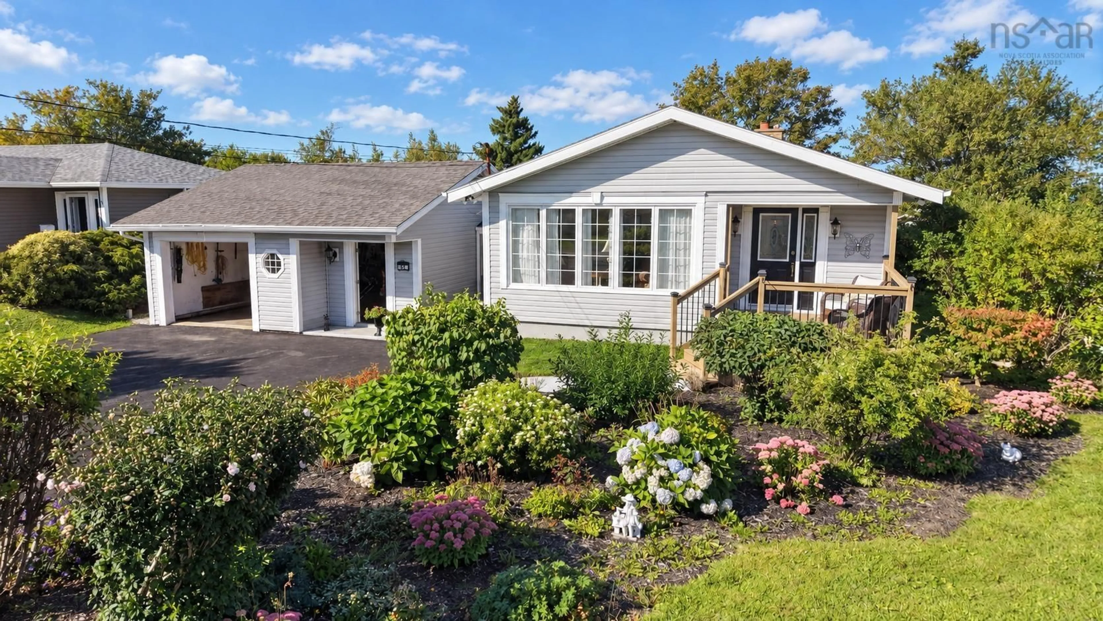 Home with vinyl exterior material, street for 54 Currie St, Glace Bay Nova Scotia B1A 5E4