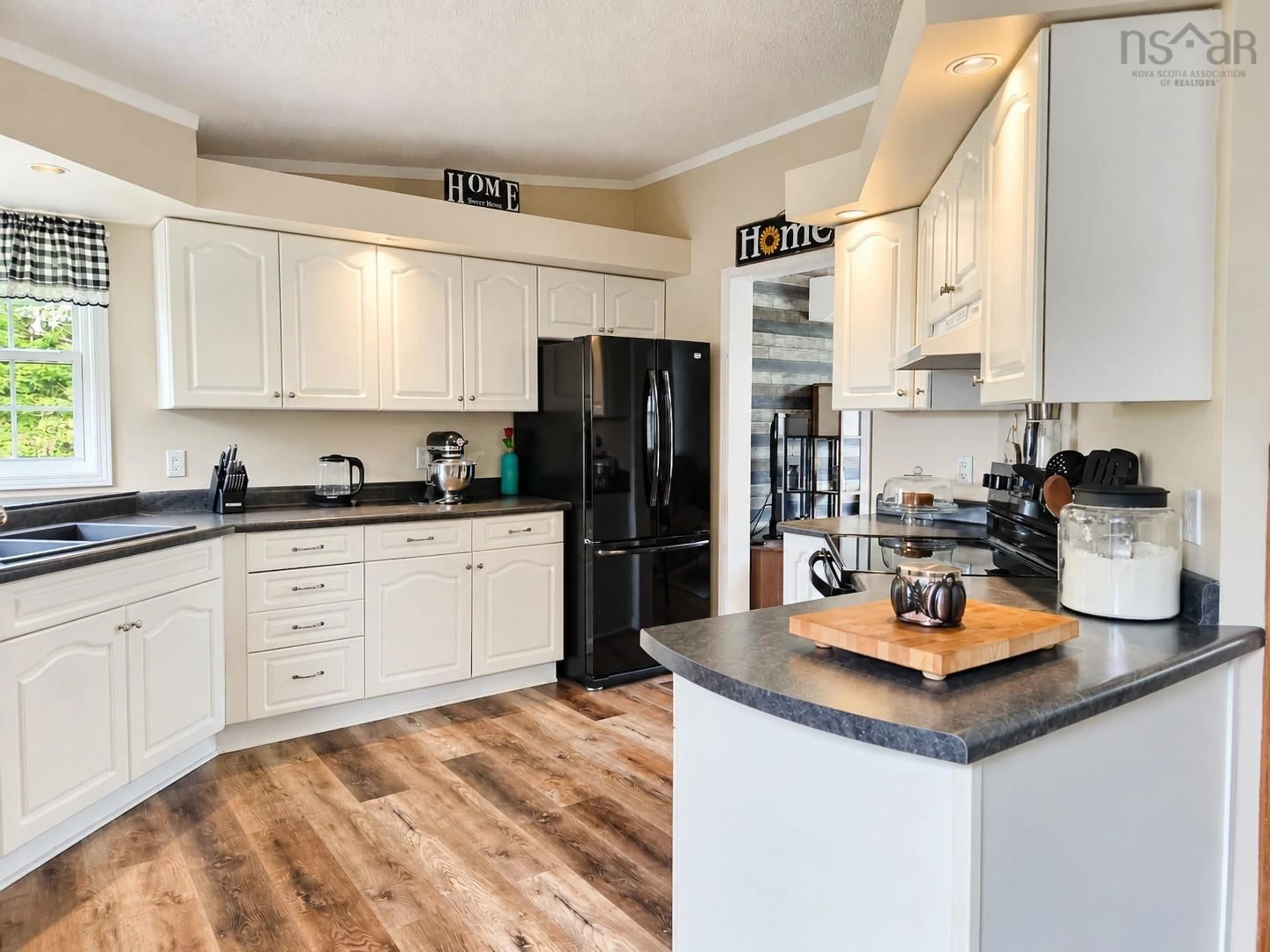 Open concept kitchen, wood/laminate floor for 1987 330 Hwy, Newellton Nova Scotia B0W 1P0