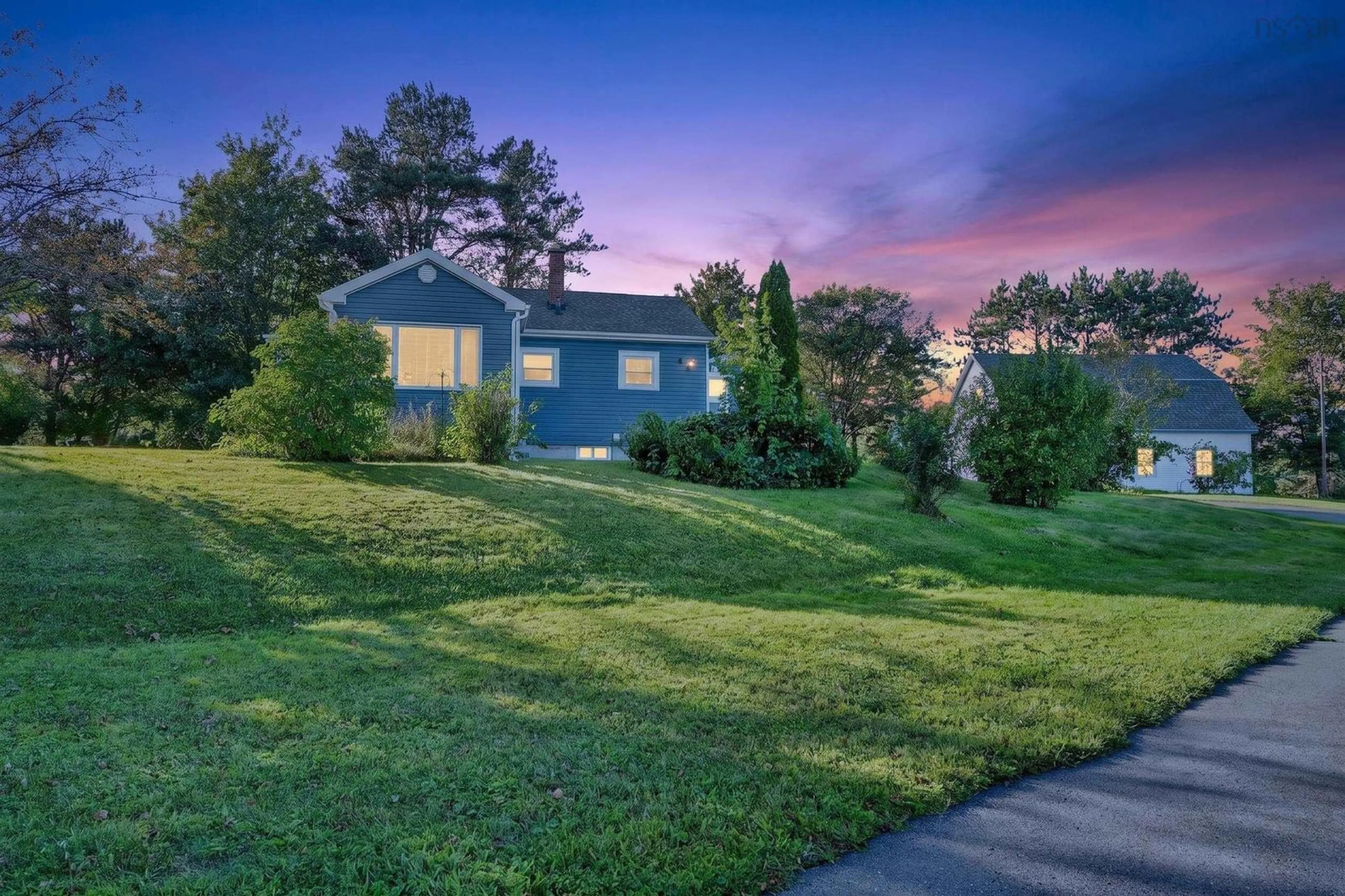 A pic from outside/outdoor area/front of a property/back of a property/a pic from drone, mountain view for 141 Riverside Dr, Sydney River Nova Scotia B1S 1G3