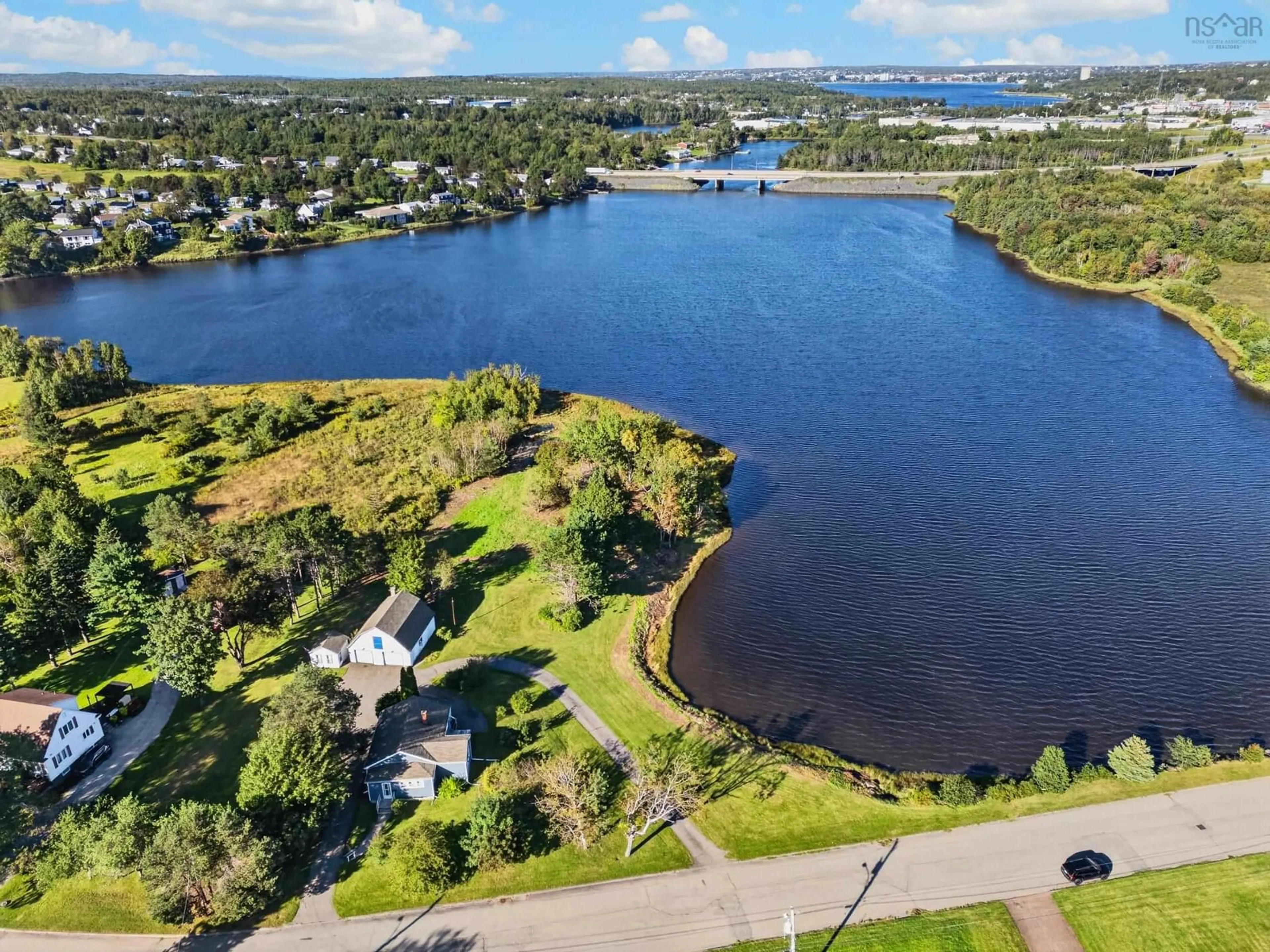 A pic from outside/outdoor area/front of a property/back of a property/a pic from drone, water/lake/river/ocean view for 141 Riverside Dr, Sydney River Nova Scotia B1S 1G3