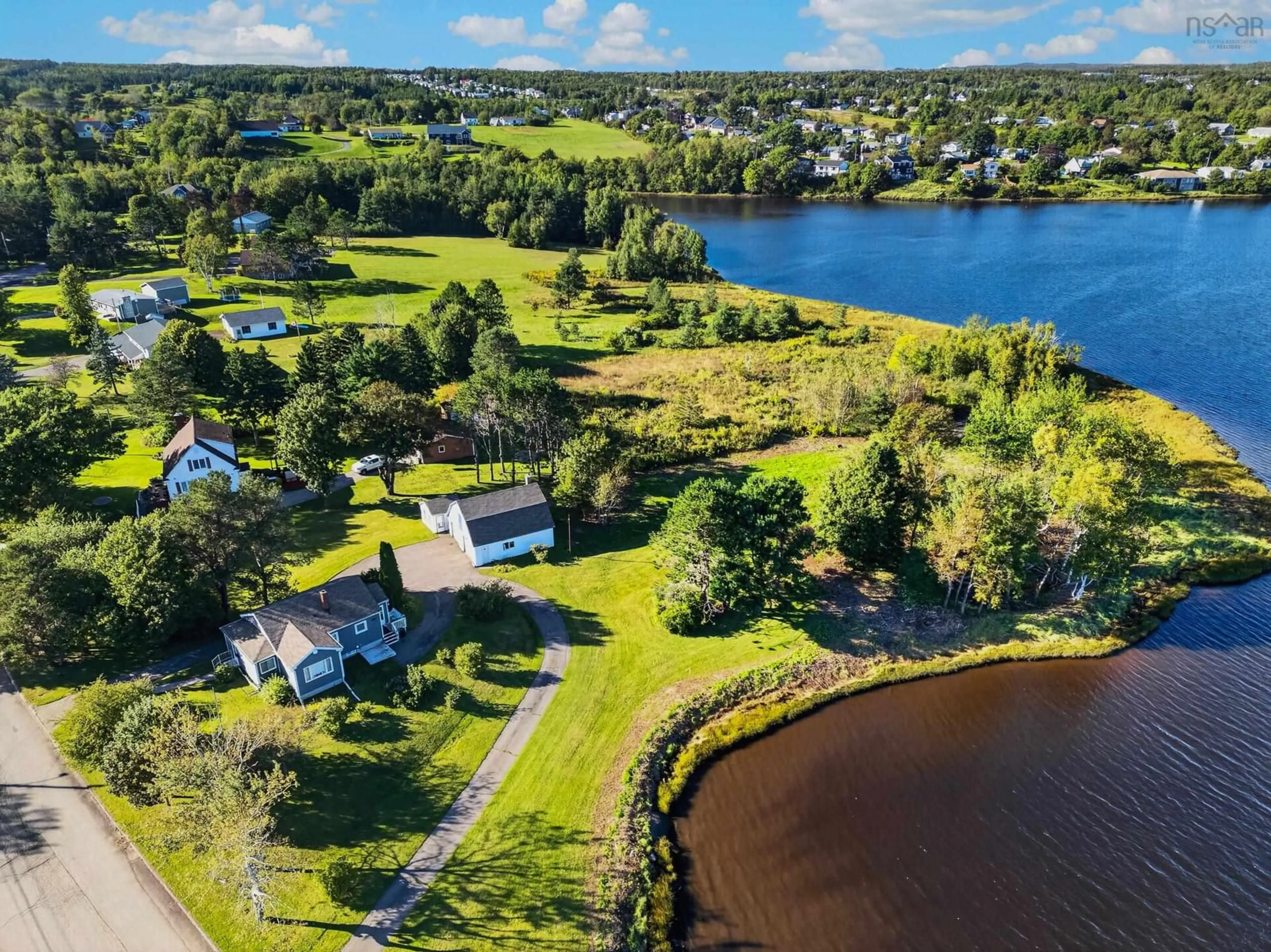 A pic from outside/outdoor area/front of a property/back of a property/a pic from drone, water/lake/river/ocean view for 141 Riverside Dr, Sydney River Nova Scotia B1S 1G3