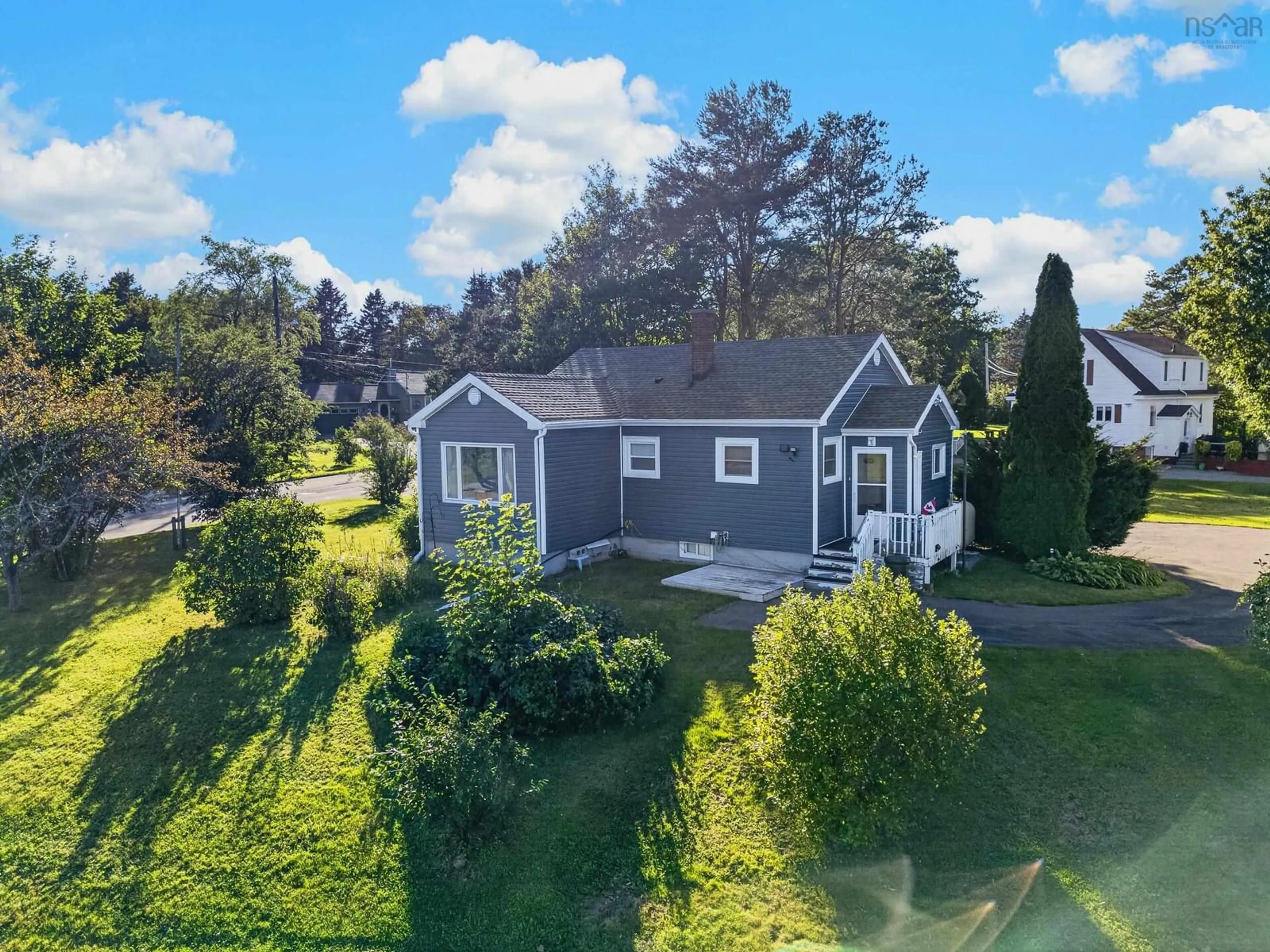 A pic from outside/outdoor area/front of a property/back of a property/a pic from drone, water/lake/river/ocean view for 141 Riverside Dr, Sydney River Nova Scotia B1S 1G3